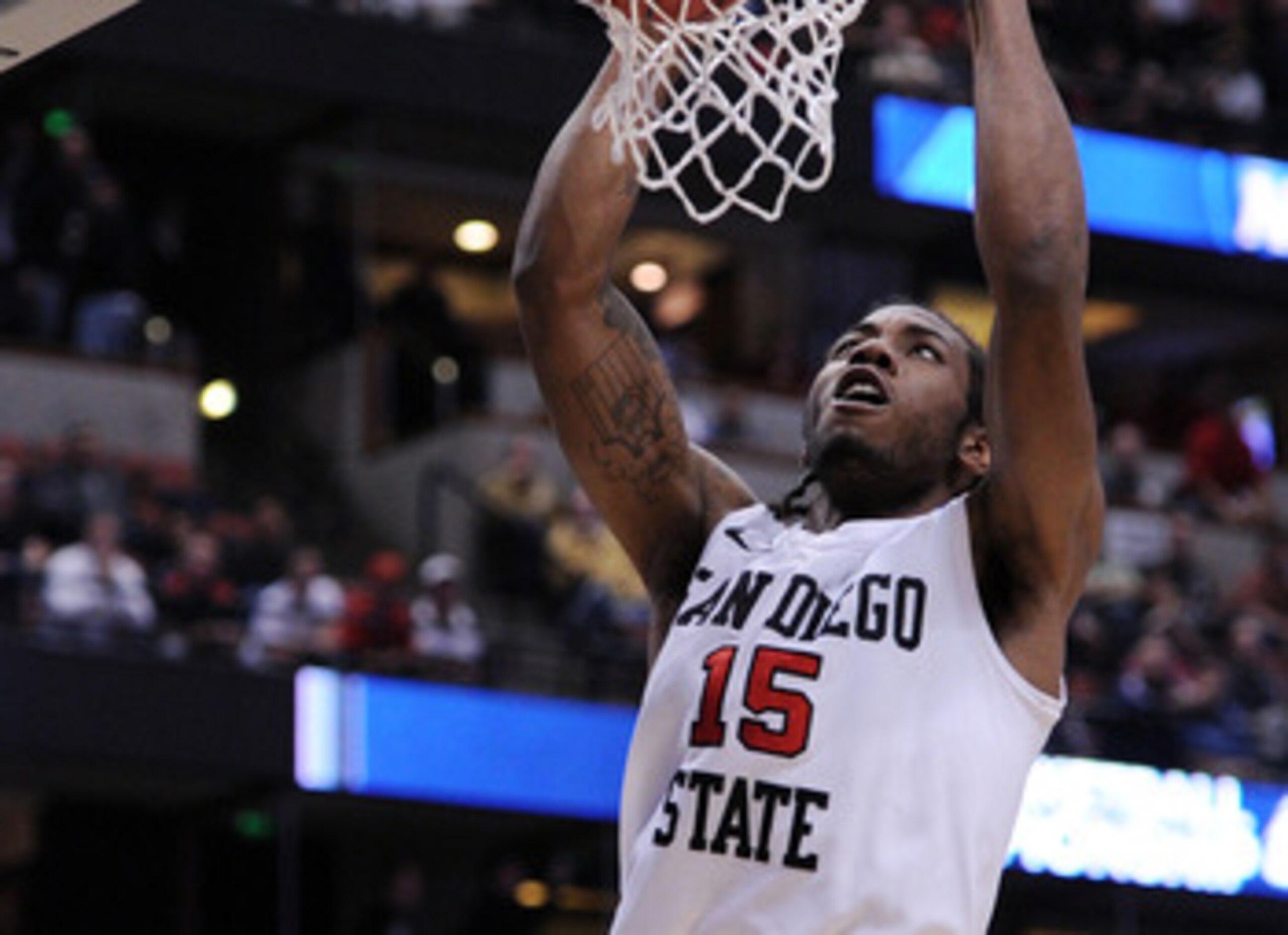 ANAHEIM, CA - MARCH 24:  Kawhi Leonard #15 of the San Diego State Aztecs dunks the ball against the Connecticut Huskies during the west regional semifinal of the 2011 NCAA men's basketball tournament at the Honda Center on March 24, 2011 in Anaheim, Calif