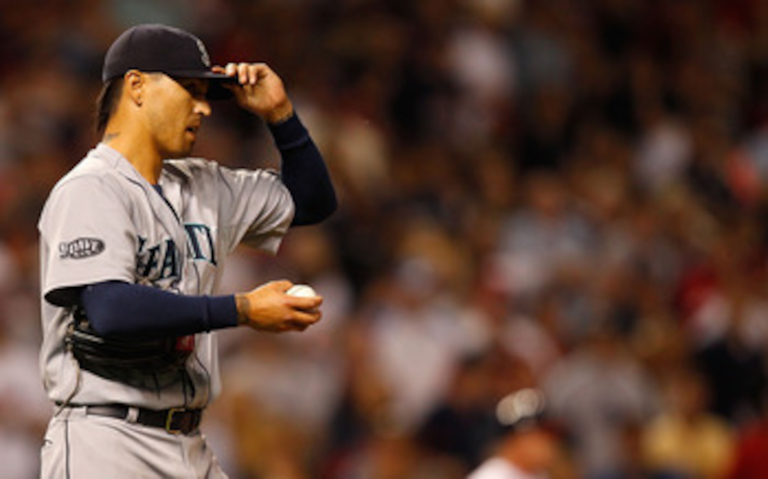 CLEVELAND - MAY 13:  Brandon League #43 of the Seattle Mariners takes a moment to himself inbetween pitches before giving up a walk-off two run home run to Travis Hafner #48 of the Cleveland Indians in the 9th inning on May 13, 2011 at Progressive Field i