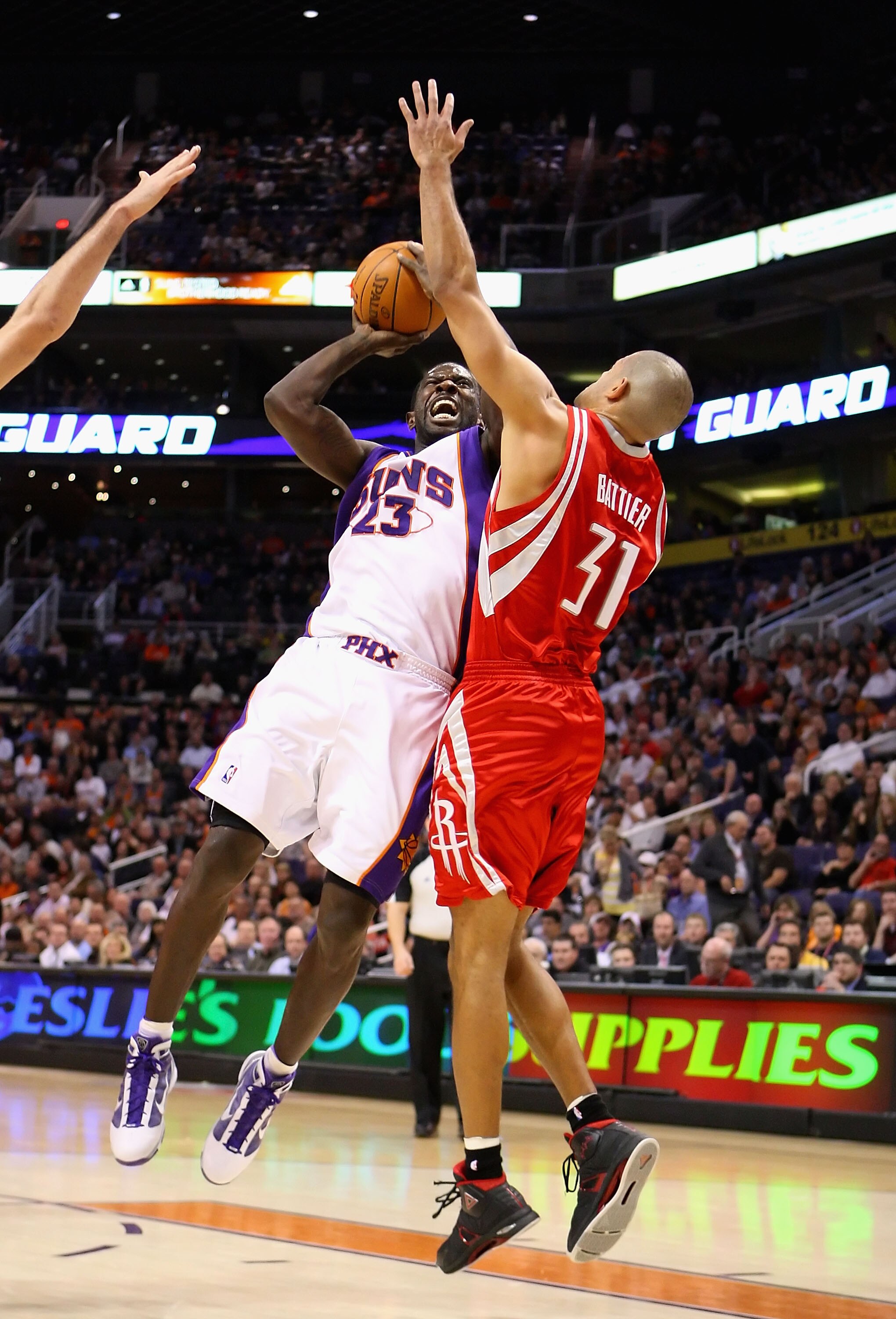 PHOENIX - JANUARY 06:  Jason Richardson #23 of the Phoenix Suns puts up a shot against Shane Battier #31 of the Houston Rockets during the NBA game at US Airways Center on January 6, 2010 in Phoenix, Arizona. The Suns defeated the Rockets 118-110.  NOTE T
