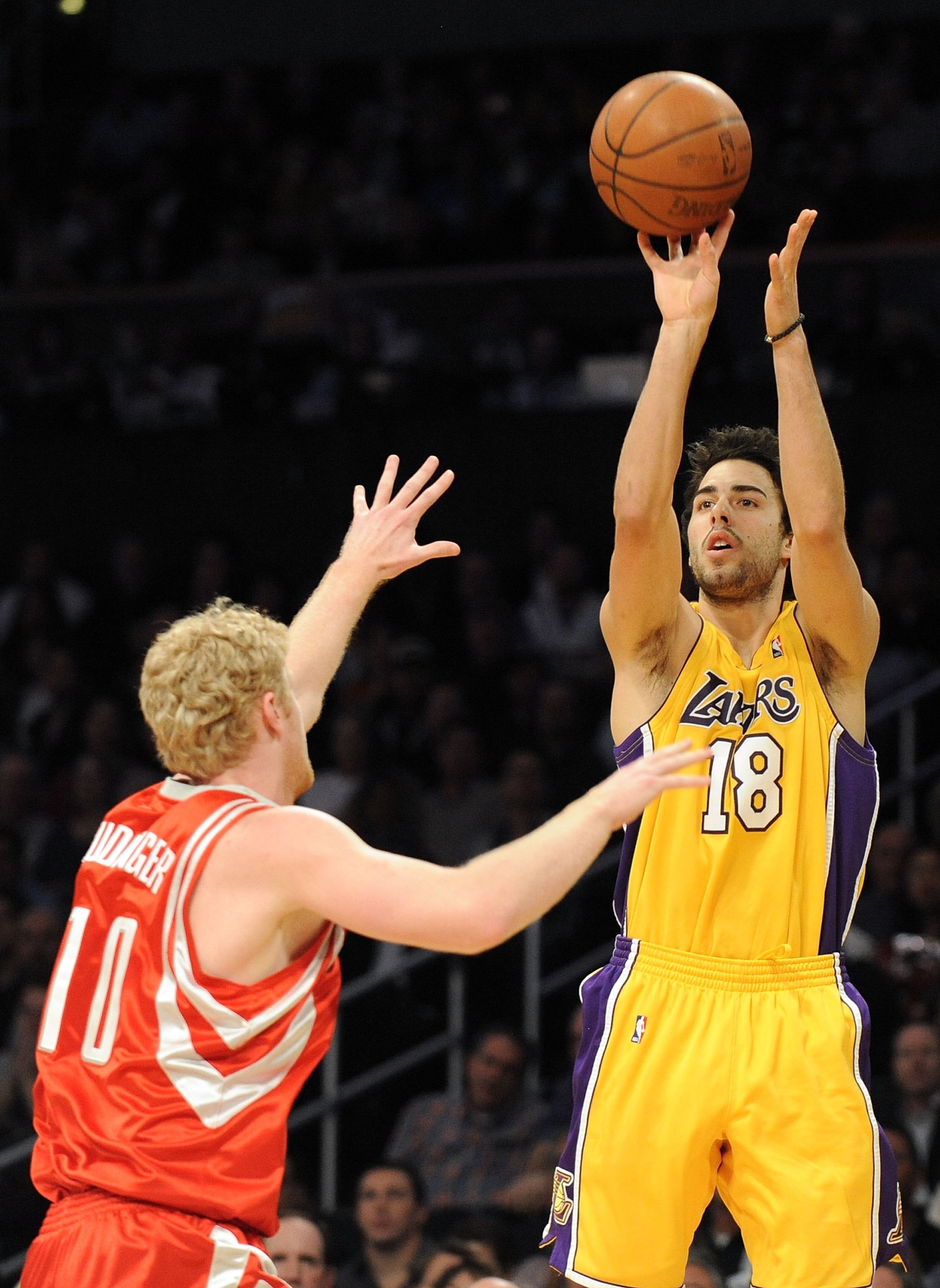 LOS ANGELES, CA - JANUARY 05: Sasha Vujacic #18 of the Los Angeles Lakers shoots a jumper from the corner in front of Chase Budinger #10 of the Houston Rockets during the game at Staples Center on January 5, 2010 in Los Angeles, California. NOTE TO USER LOS ANGELES, CA - JANUARY 05: Sasha Vujacic #18 of the Los Angeles Lakers shoots a jumper from the corner in front of Chase Budinger #10 of the Houston Rockets during the game at Staples Center on January 5, 2010 in Los Angeles, California. NOTE TO USER