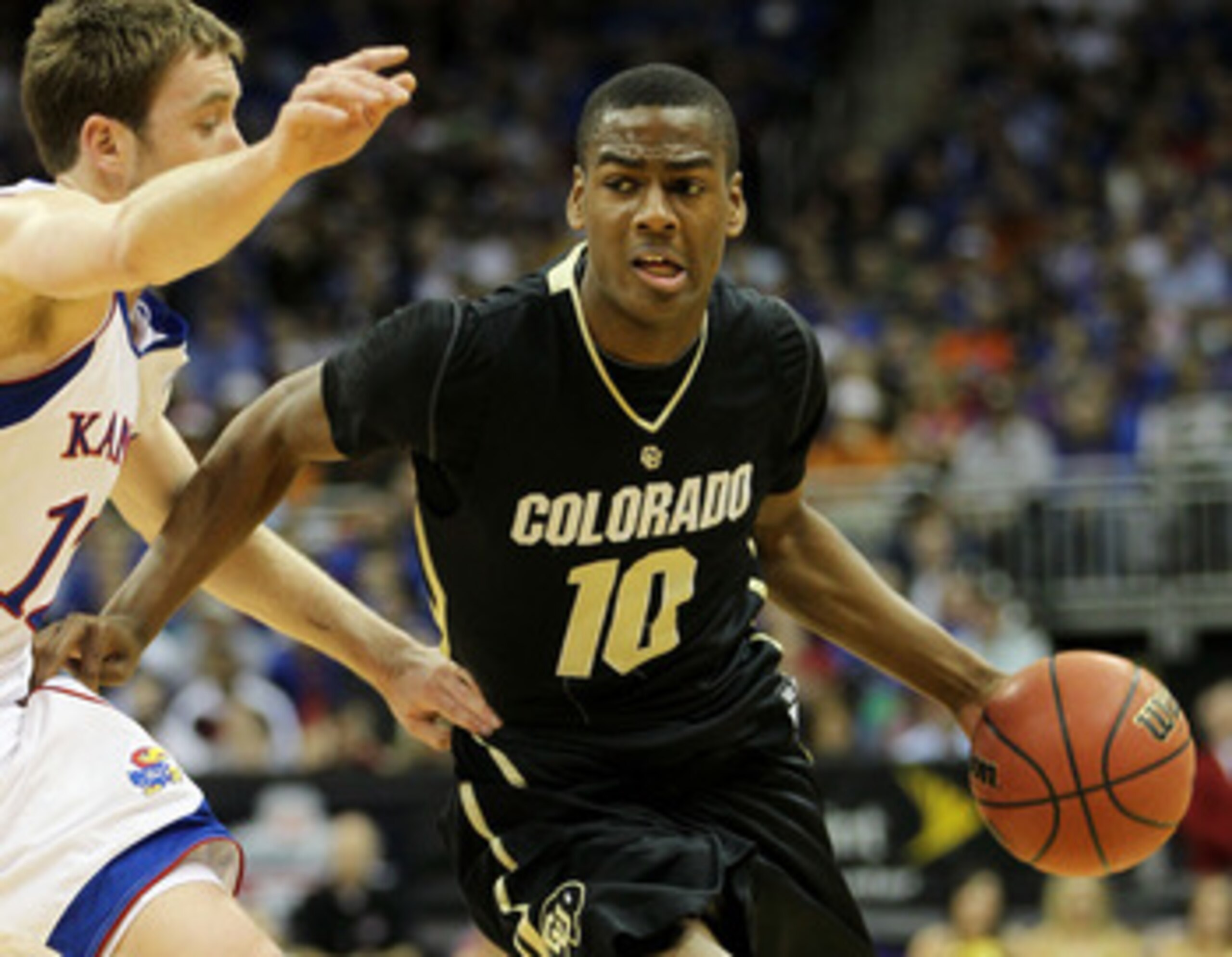 KANSAS CITY, MO - MARCH 11:  Alec Burks #10 of the Colorado Buffaloes drives with the ball against the Kansas Jayhawks during their semifinal game in the 2011 Phillips 66 Big 12 Men's Basketball Tournament at Sprint Center on March 11, 2011 in Kansas City