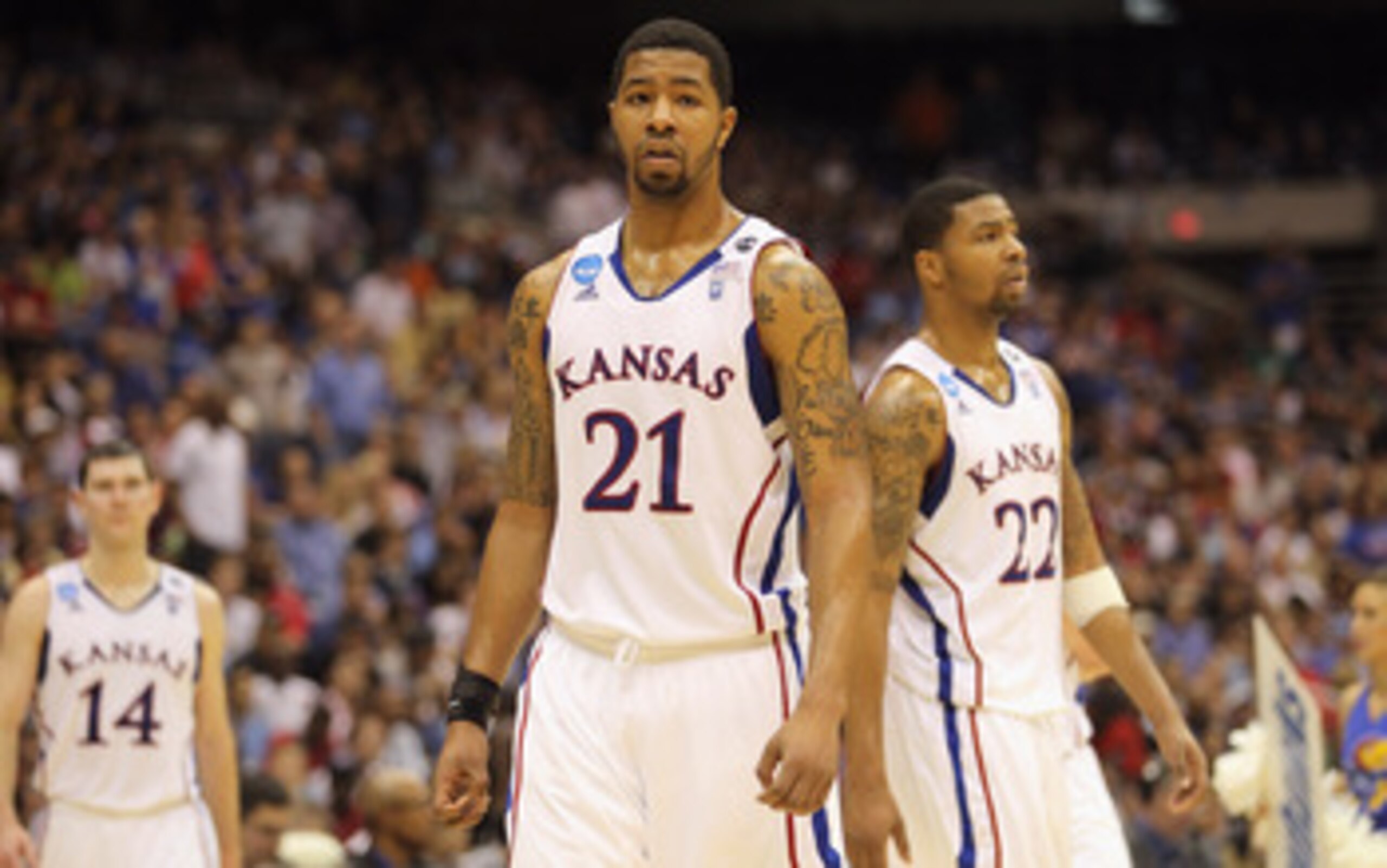 SAN ANTONIO, TX - MARCH 27:  Markieff Morris #21 and Marcus Morris #22 of the Kansas Jayhawks react during the southwest regional final of the 2011 NCAA men's basketball tournament against the Virginia Commonwealth Rams at the Alamodome on March 27, 2011