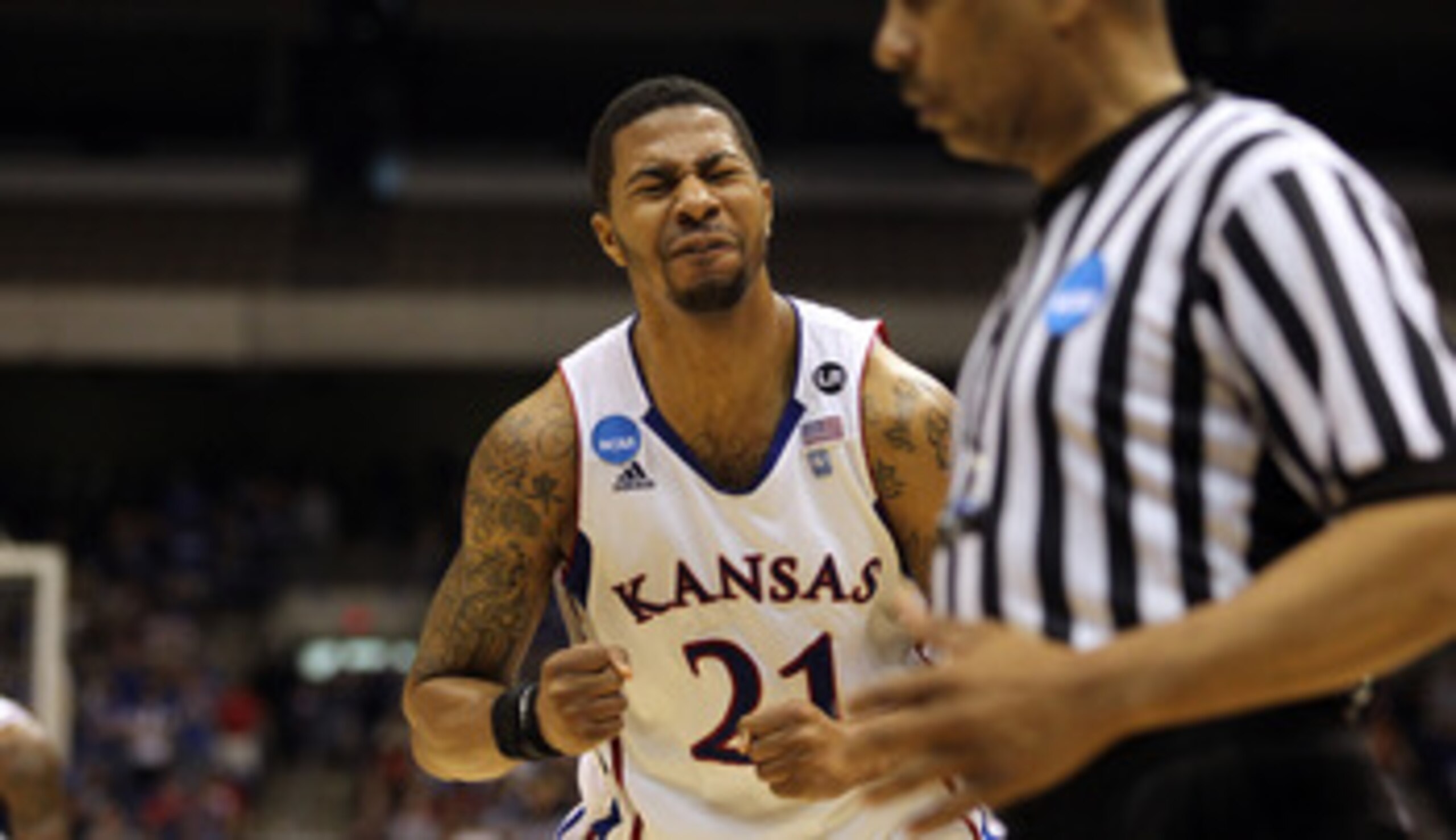 SAN ANTONIO, TX - MARCH 27:  Markieff Morris #21 of the Kansas Jayhawks reacts during the southwest regional final of the 2011 NCAA men's basketball tournament against the Virginia Commonwealth Rams at the Alamodome on March 27, 2011 in San Antonio, Texas