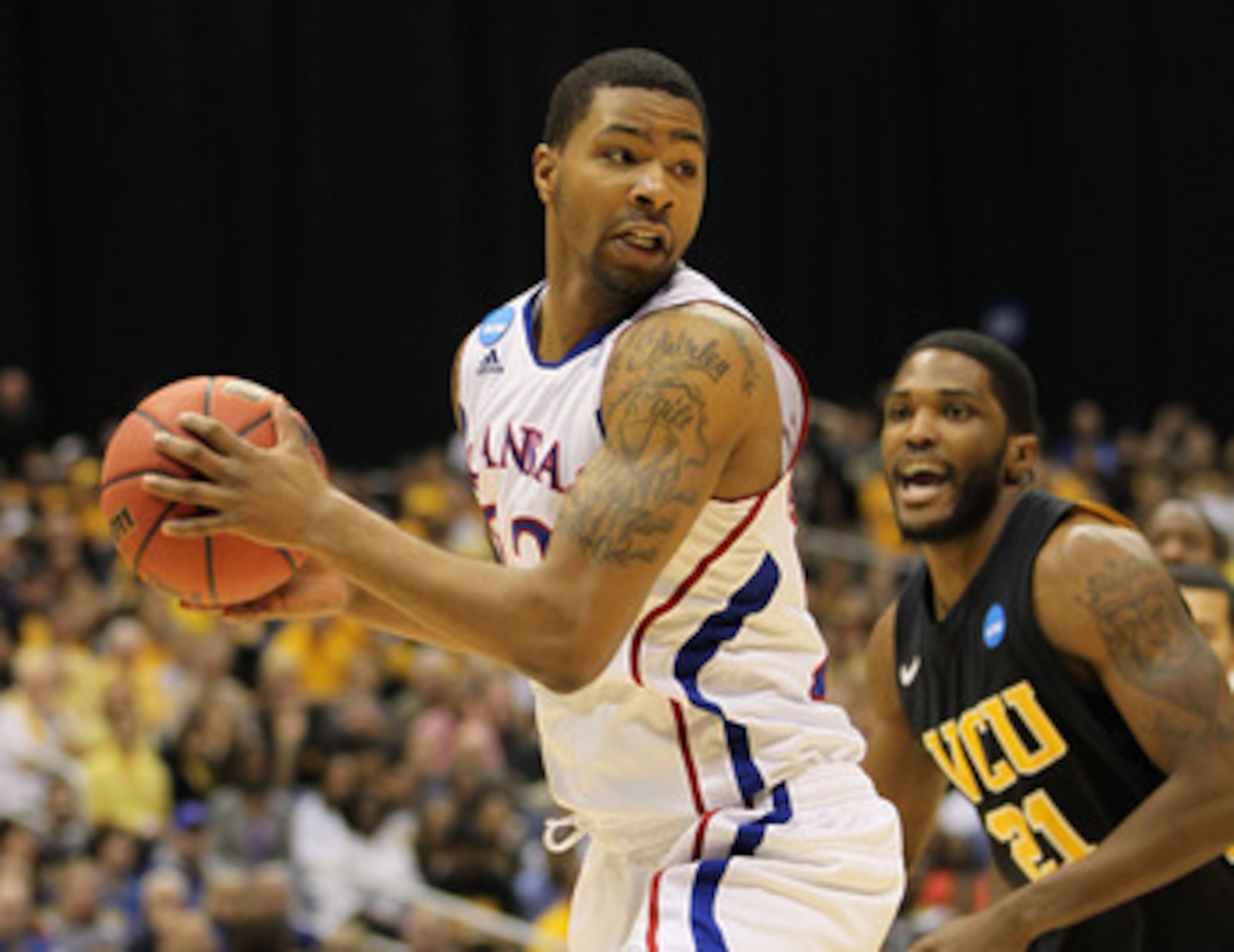 SAN ANTONIO, TX - MARCH 27: Marcus Morris #22 of the Kansas Jayhawks handles the ball against Jamie Skeen #21 of the Virginia Commonwealth Rams during the southwest regional final of the 2011 NCAA men's basketball tournament at the Alamodome on March 27, SAN ANTONIO, TX - MARCH 27: Marcus Morris #22 of the Kansas Jayhawks handles the ball against Jamie Skeen #21 of the Virginia Commonwealth Rams during the southwest regional final of the 2011 NCAA men's basketball tournament at the Alamodome on March 27,
