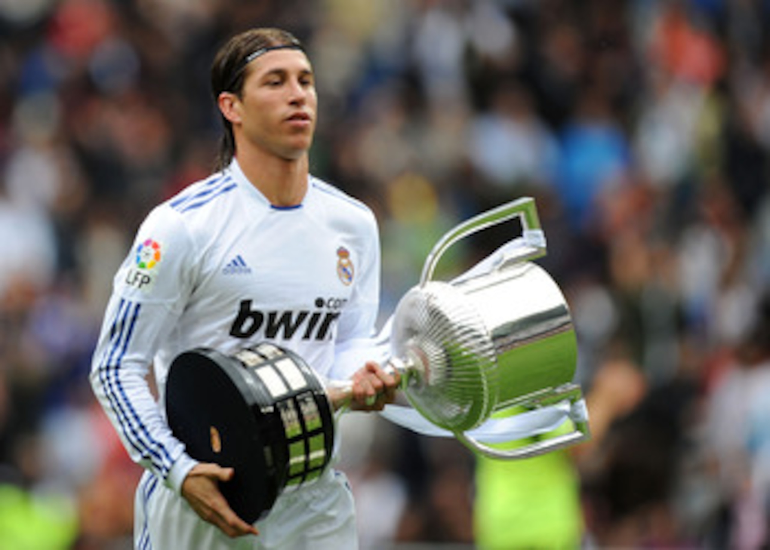 MADRID, SPAIN - APRIL 30: Sergio Ramos of Real Madrid walks away with the recently won Copa del Rey trophy before the La Liga match between Real Madrid and Real Zaragona at Estadio Santiago Bernabeu on April 30, 2011 in Madrid, Spain. (Photo by Denis Doy MADRID, SPAIN - APRIL 30: Sergio Ramos of Real Madrid walks away with the recently won Copa del Rey trophy before the La Liga match between Real Madrid and Real Zaragona at Estadio Santiago Bernabeu on April 30, 2011 in Madrid, Spain. (Photo by Denis Doy