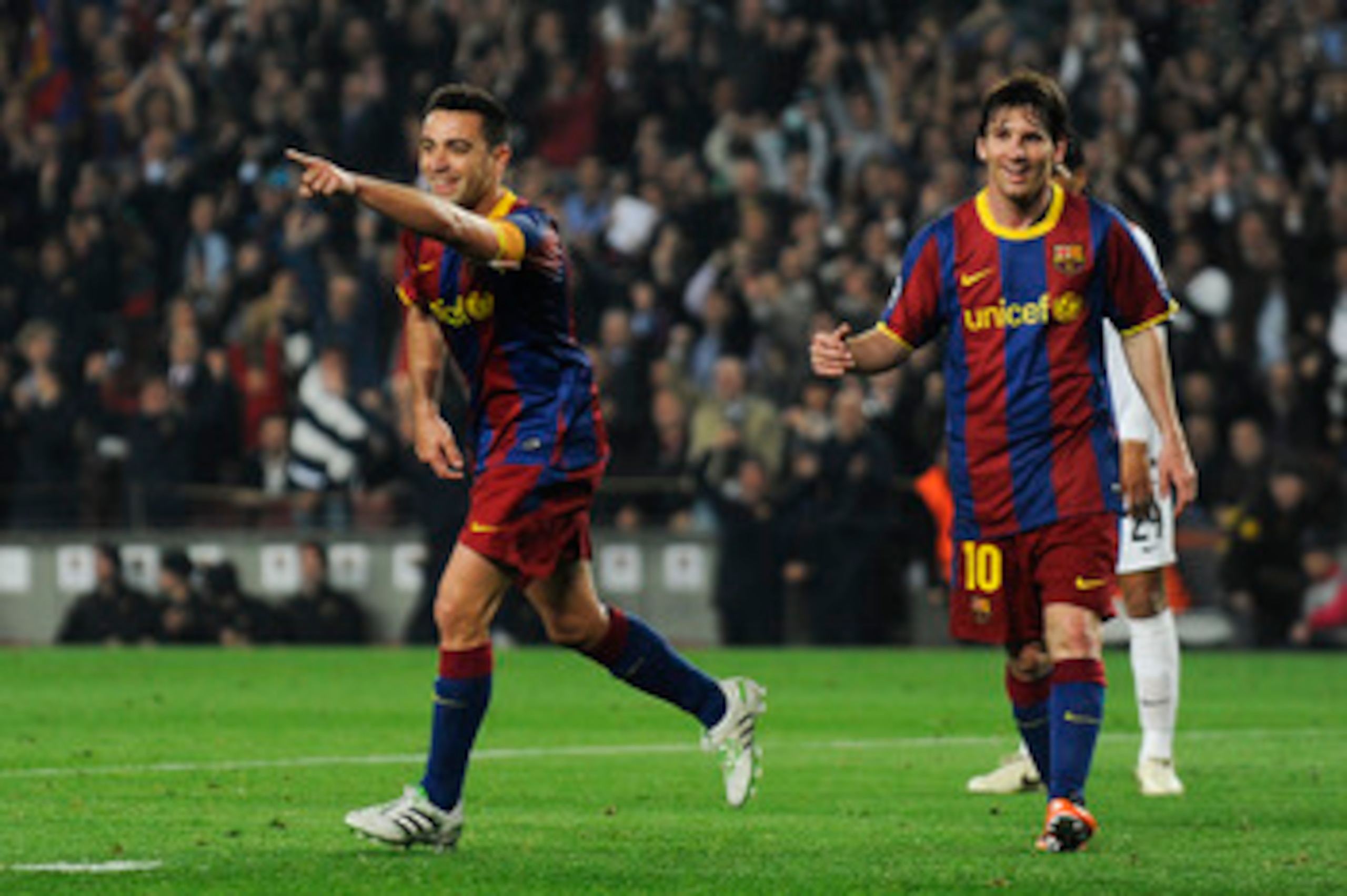 BARCELONA, SPAIN - APRIL 06: Xavi Hernandez and Lionel Messi of FC Barcelona (L) celebrate after Xavi scored his team's fifth goal during the UEFA Champions League quarter final first leg match between Barcelona and Shakhtar Donetsk at the Camp Nou Stadi BARCELONA, SPAIN - APRIL 06: Xavi Hernandez and Lionel Messi of FC Barcelona (L) celebrate after Xavi scored his team's fifth goal during the UEFA Champions League quarter final first leg match between Barcelona and Shakhtar Donetsk at the Camp Nou Stadi