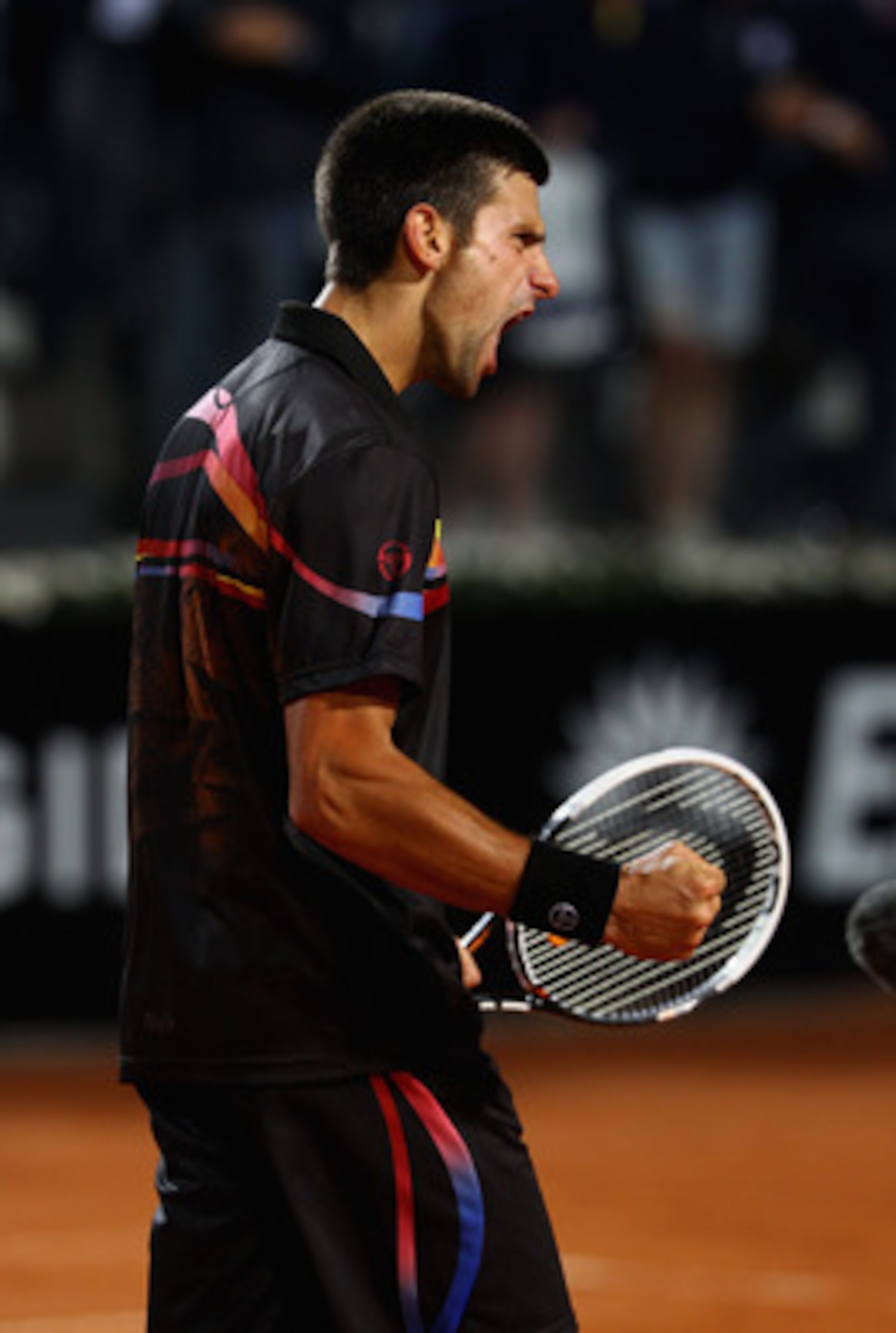 ROME, ITALY - MAY 14:  Novak Djokovic of Serbia celebrates a point during the tie break in his semi final match against Andy Murray of Great Britain during day seven of the Internazoinali BNL D'Italia at the Foro Italico Tennis Centre  on May 14, 2011 in 