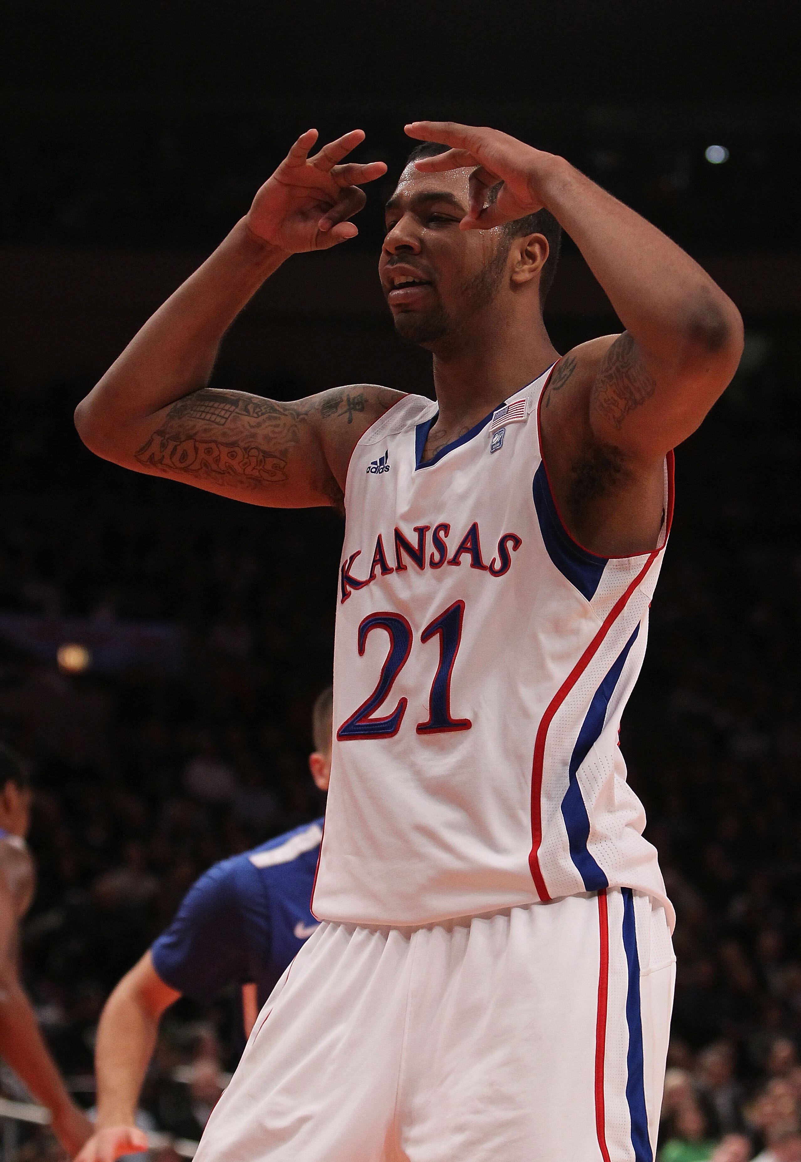 NEW YORK, NY - DECEMBER 07:  Markieff Morris #21 of the Kansas Jayhawks celebrates a dunk against the Memphis Tigers during their game at the Jimmy V Classic at Madison Square Garden on December 7, 2010 in New York City.  (Photo by Nick Laham/Getty Images