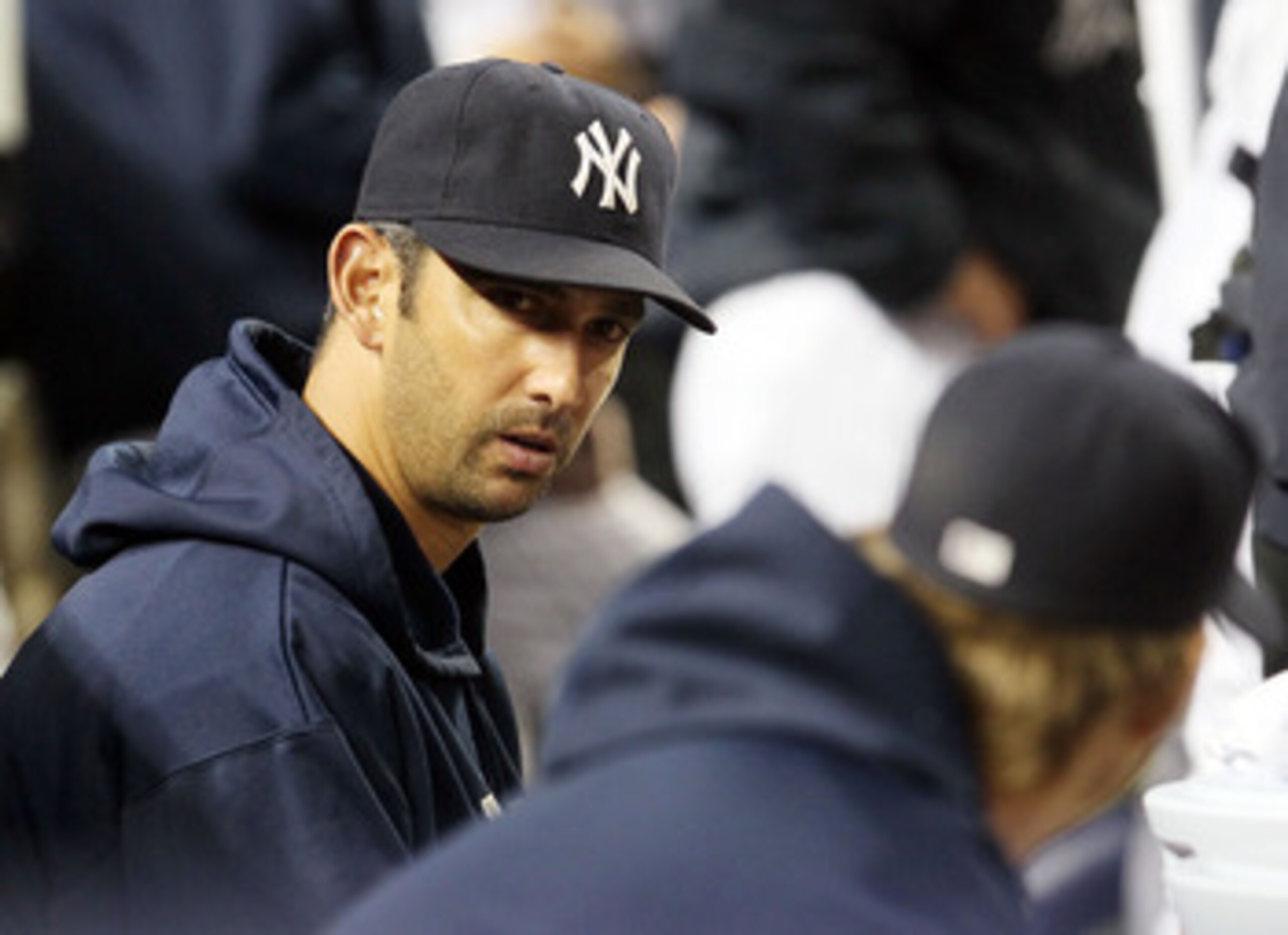 NEW YORK, NY - MAY 14:  Jorge Posada #20 of the New York Yankees looks on from the bench during the game against the Boston Red Sox on May 14, 2011 at Yankee Stadium in the Bronx borough of New York City. Posada pulled himself from the starting lineup pri