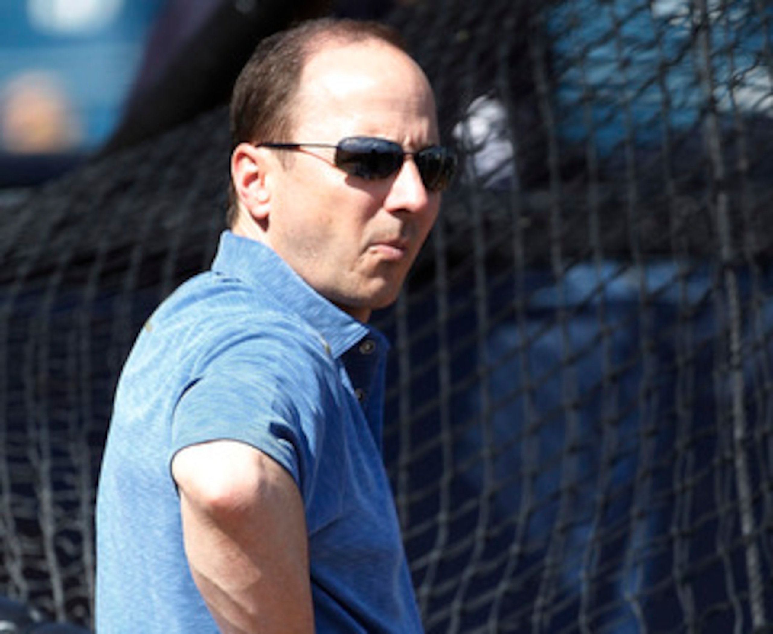 TAMPA, FL - FEBRUARY 21:  Brian Cashman Senior Vice President and General Manager of the New York Yankees watches the action during the first full team workout of Spring Training on February 20, 2011 at the George M. Steinbrenner Field in Tampa, Florida.