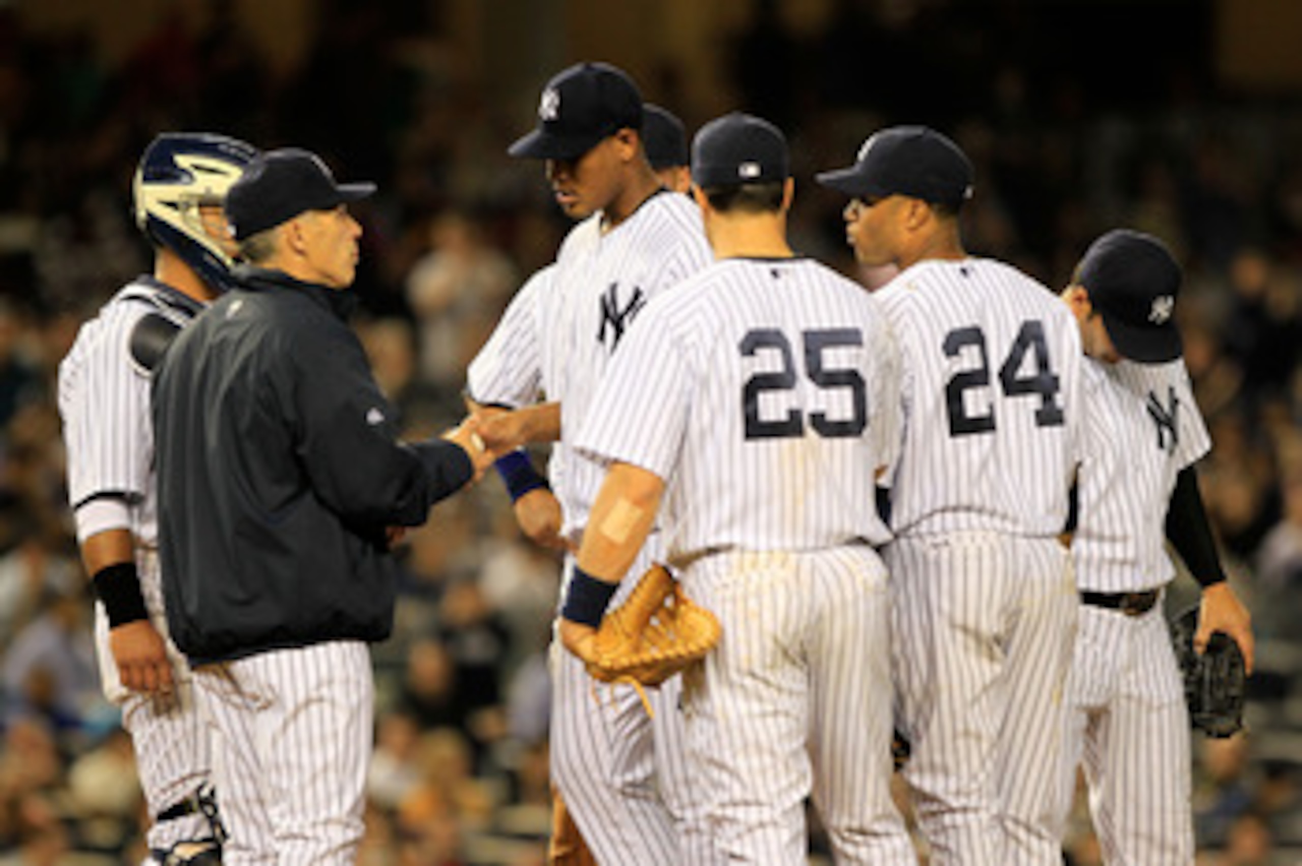NEW YORK, NY - APRIL 26:  Pitcher Ivan Nova #47 of the New York Yankees hand the leaves the ball to Manager Joe Girardi as he leaves the game in the seventh inning against the Chicago White Sox at Yankee Stadium on April 26, 2011 in the Bronx borough of N