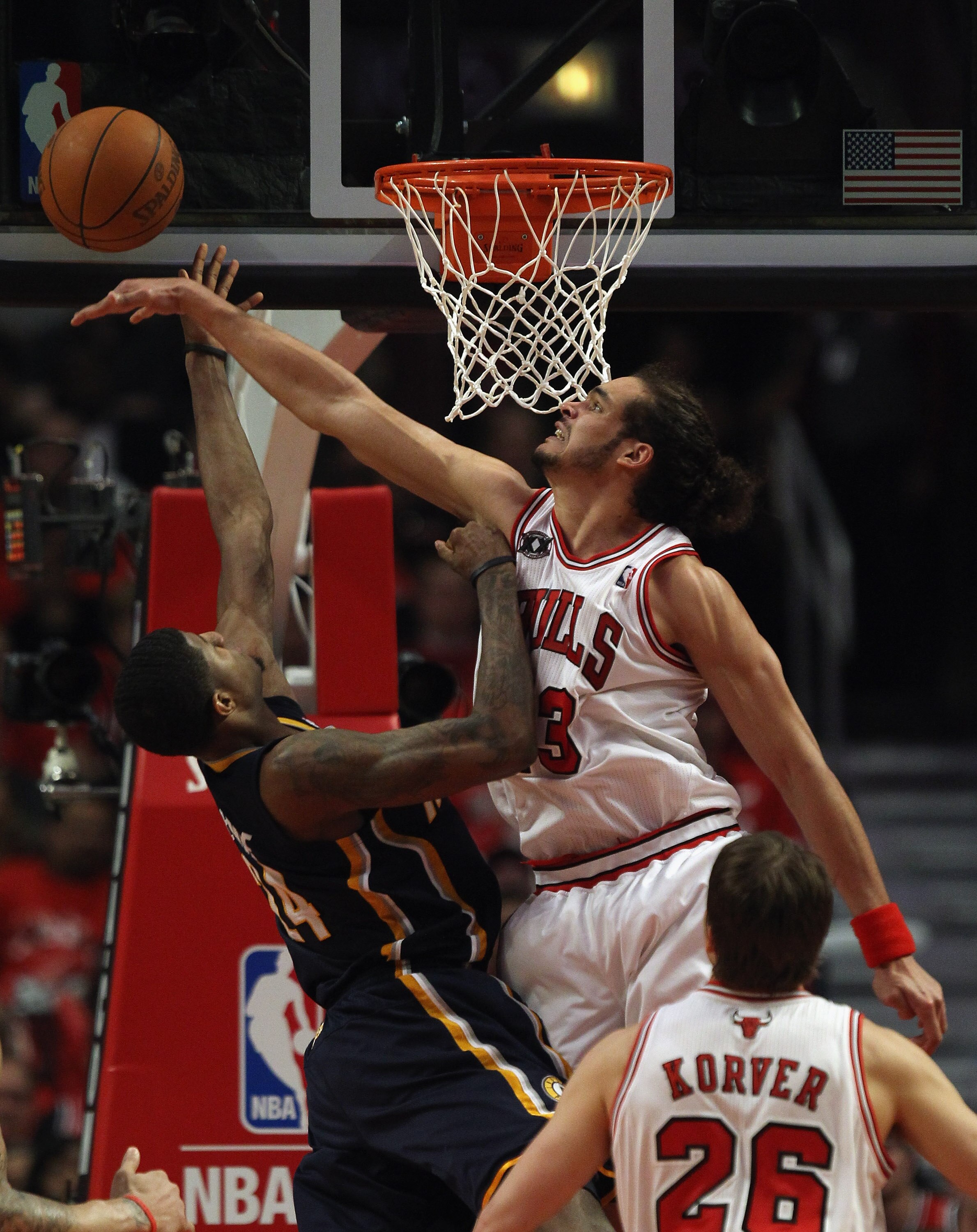 CHICAGO, IL - APRIL 18: Joakim Noah #13 of the Chicago Bulls blocks a shot by Paul George #24 of the Indiana Pacers in Game Two of the Eastern Conference Quarterfinals in the 2011 NBA Playoffs at the United Center on April 18, 2011 in Chicago, Illinois. T