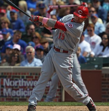 CHICAGO, IL - MAY 08: Joey Votto #19 of the Cincinnati Reds hits the ball against the Chicago Cubs at Wrigley Field on May 8, 2011 in Chicago, Illinois. The Reds defeated the Cubs 2-0. (Photo by Jonathan Daniel/Getty Images)