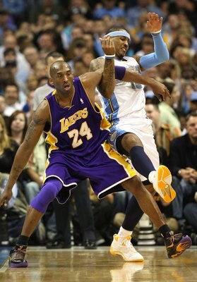 DENVER - MAY 25:  Kobe Bryant #24 of the Los Angeles Lakers defends against Carmelo Anthony #15 of the Denver Nuggets in Game Four of the Western Conference Finals during the 2009 NBA Playoffs at Pepsi Center on May 25, 2009 in Denver, Colorado. NOTE TO U