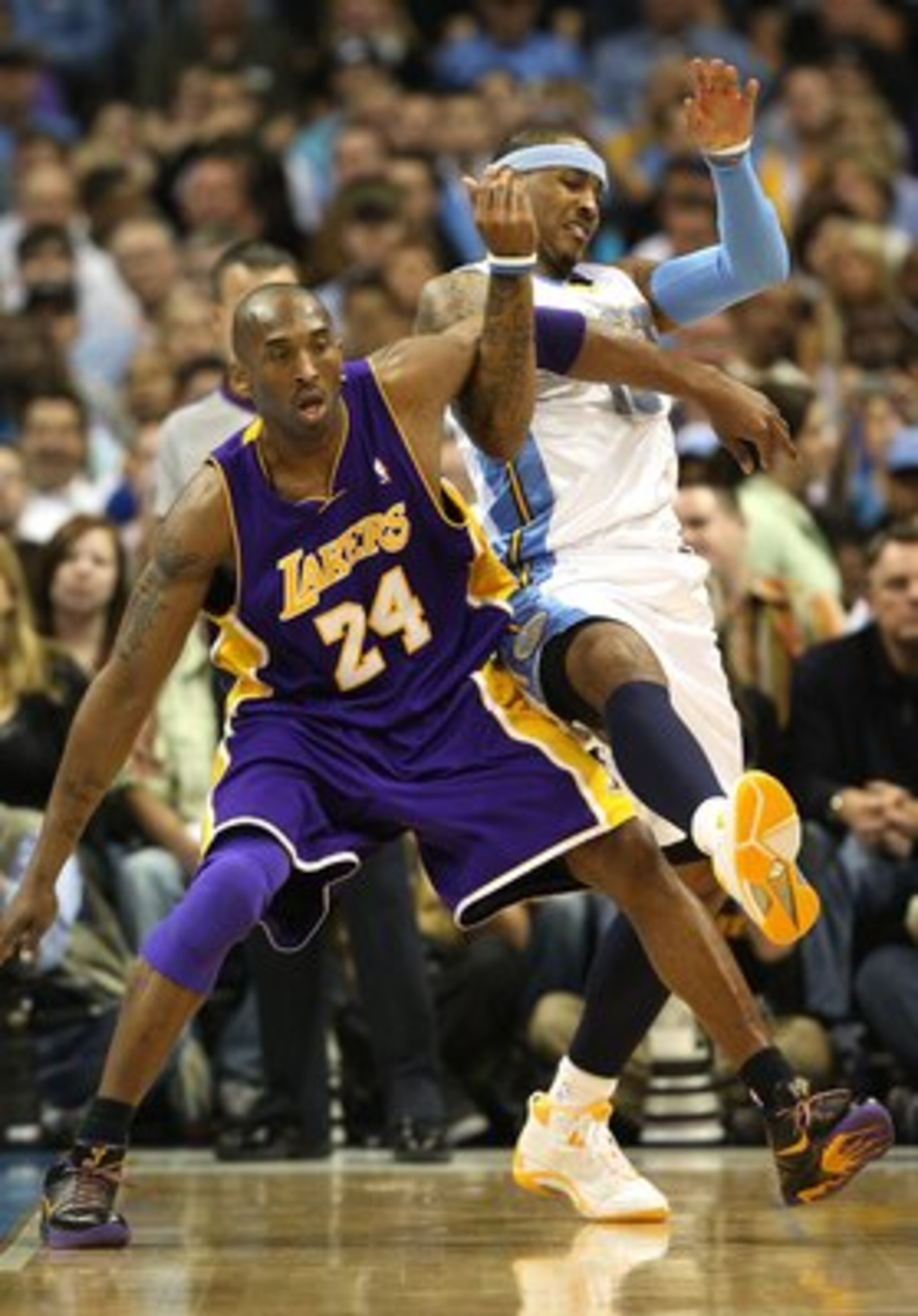 DENVER - MAY 25:  Kobe Bryant #24 of the Los Angeles Lakers defends against Carmelo Anthony #15 of the Denver Nuggets in Game Four of the Western Conference Finals during the 2009 NBA Playoffs at Pepsi Center on May 25, 2009 in Denver, Colorado. NOTE TO U
