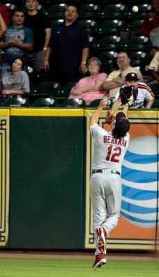 HOUSTON - APRIL 27:  Right fielder Lance Berkman #12 of the St. Louis Cardinals can't make the catch on a fly ball by Angel Sanchez #36  of the Houston Astros at Minute Maid Park on April 27, 2011 in Houston, Texas.  (Photo by Bob Levey/Getty Images)