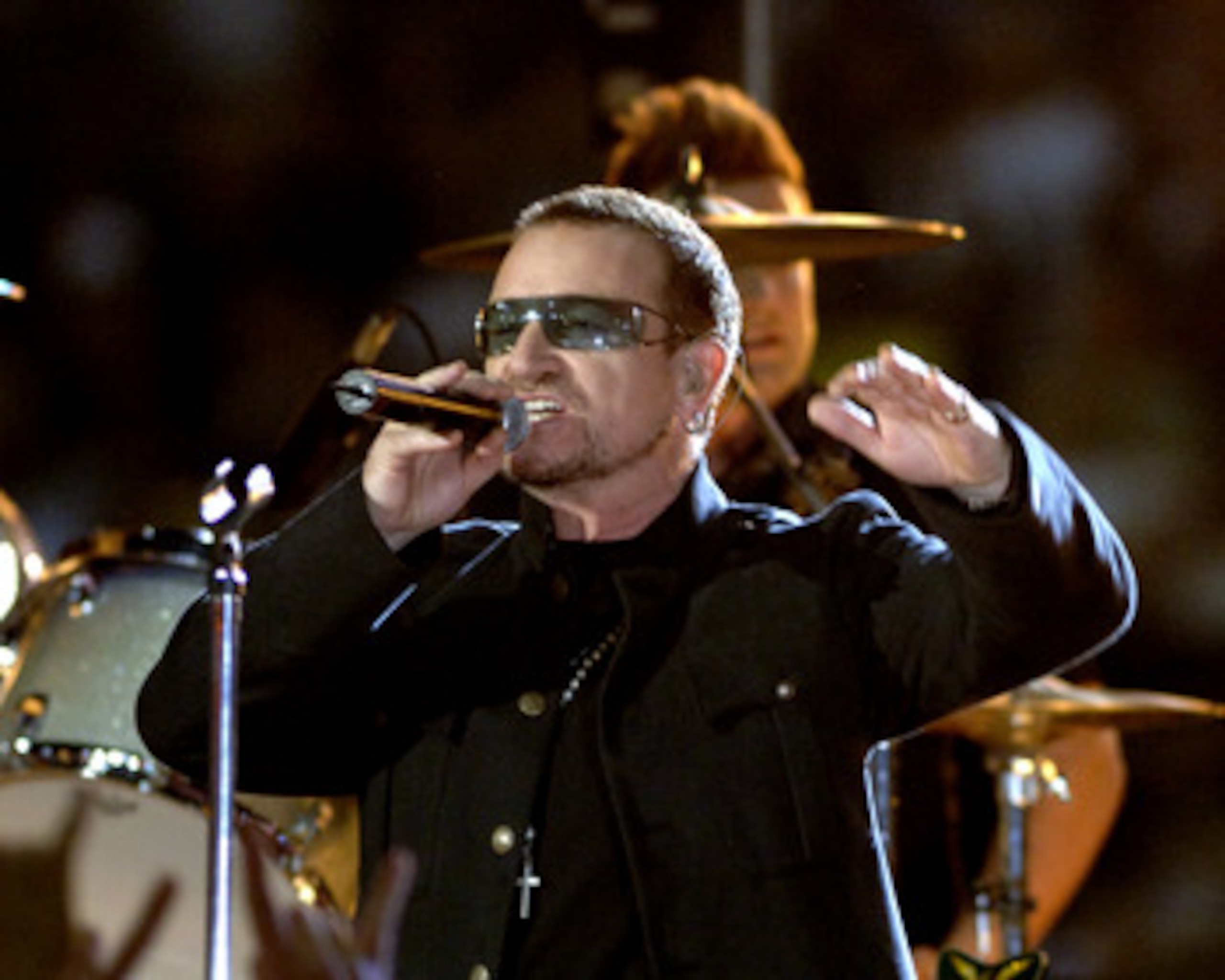 Bono of U2 performs  during a pre-game  concert inside  the Louisana Superdome before  the ESPN Monday Night Football  game September 25, 2006 in New Orleans. (Photo by Al Messerschmidt/Getty Images)