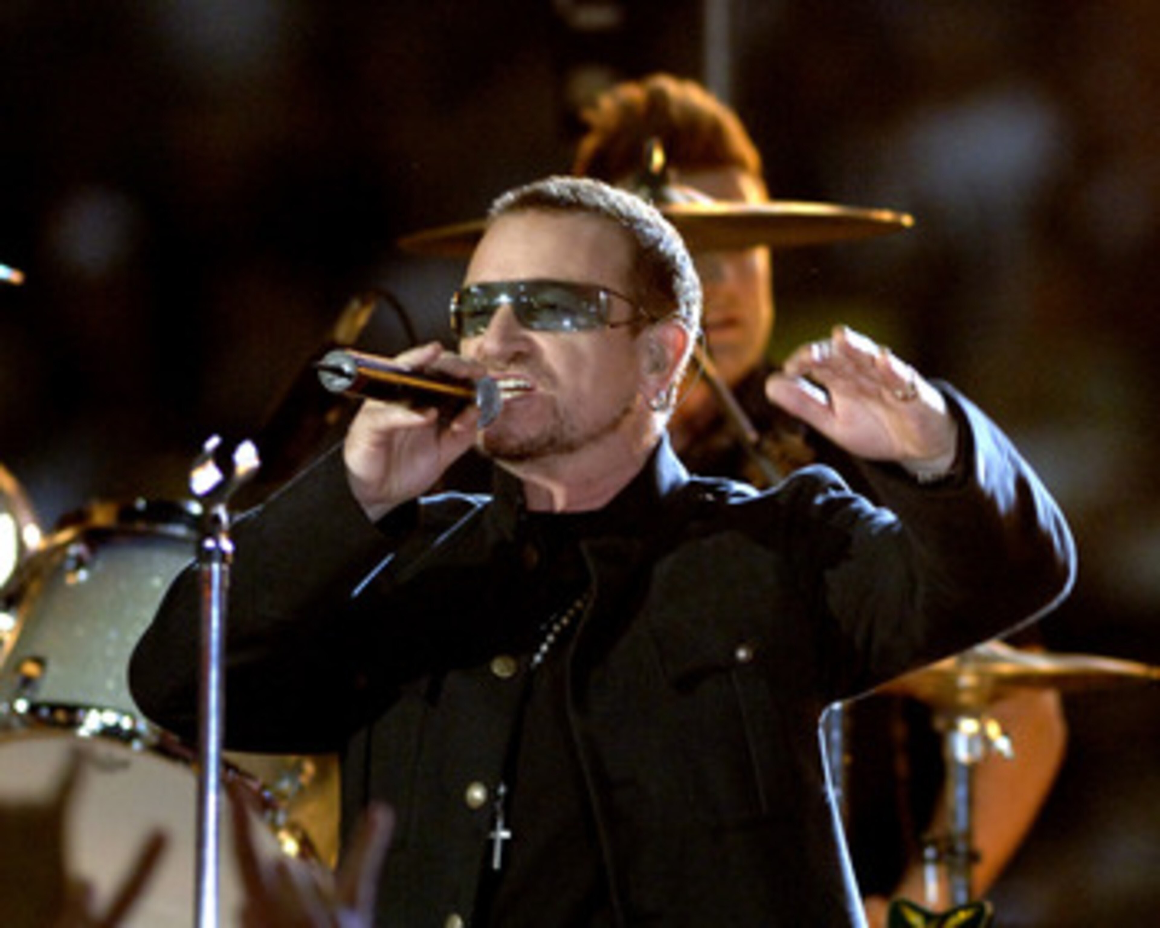 Bono of U2 performs  during a pre-game  concert inside  the Louisana Superdome before  the ESPN Monday Night Football  game September 25, 2006 in New Orleans. (Photo by Al Messerschmidt/Getty Images)