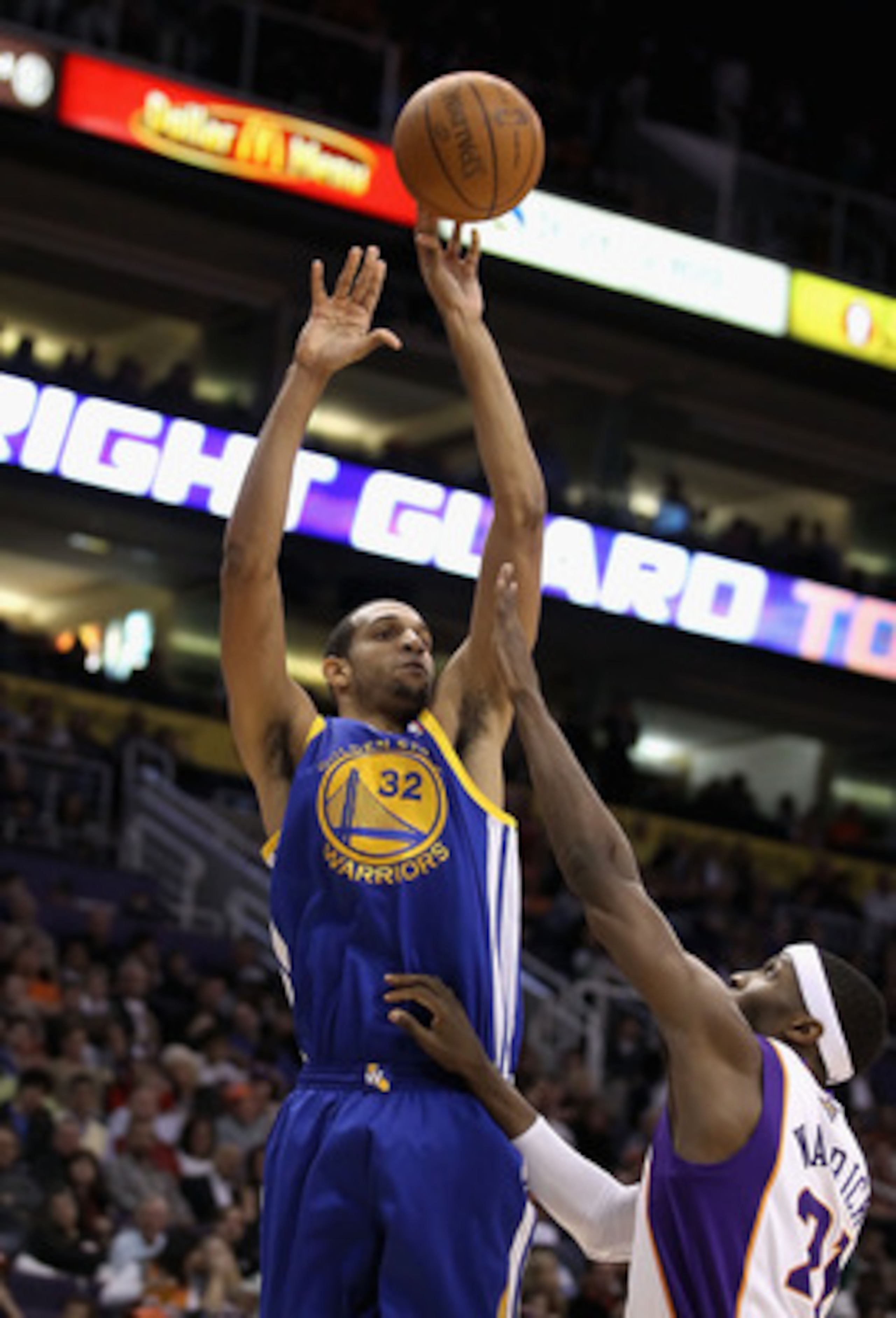 PHOENIX, AZ - FEBRUARY 10:  Brandan Wright #32 of the Golden State Warriors puts up a shot over Hakim Warrick #21 of the Phoenix Suns during the NBA game at US Airways Center on February 10, 2011 in Phoenix, Arizona. The Suns defeated the Warriors 112-88.