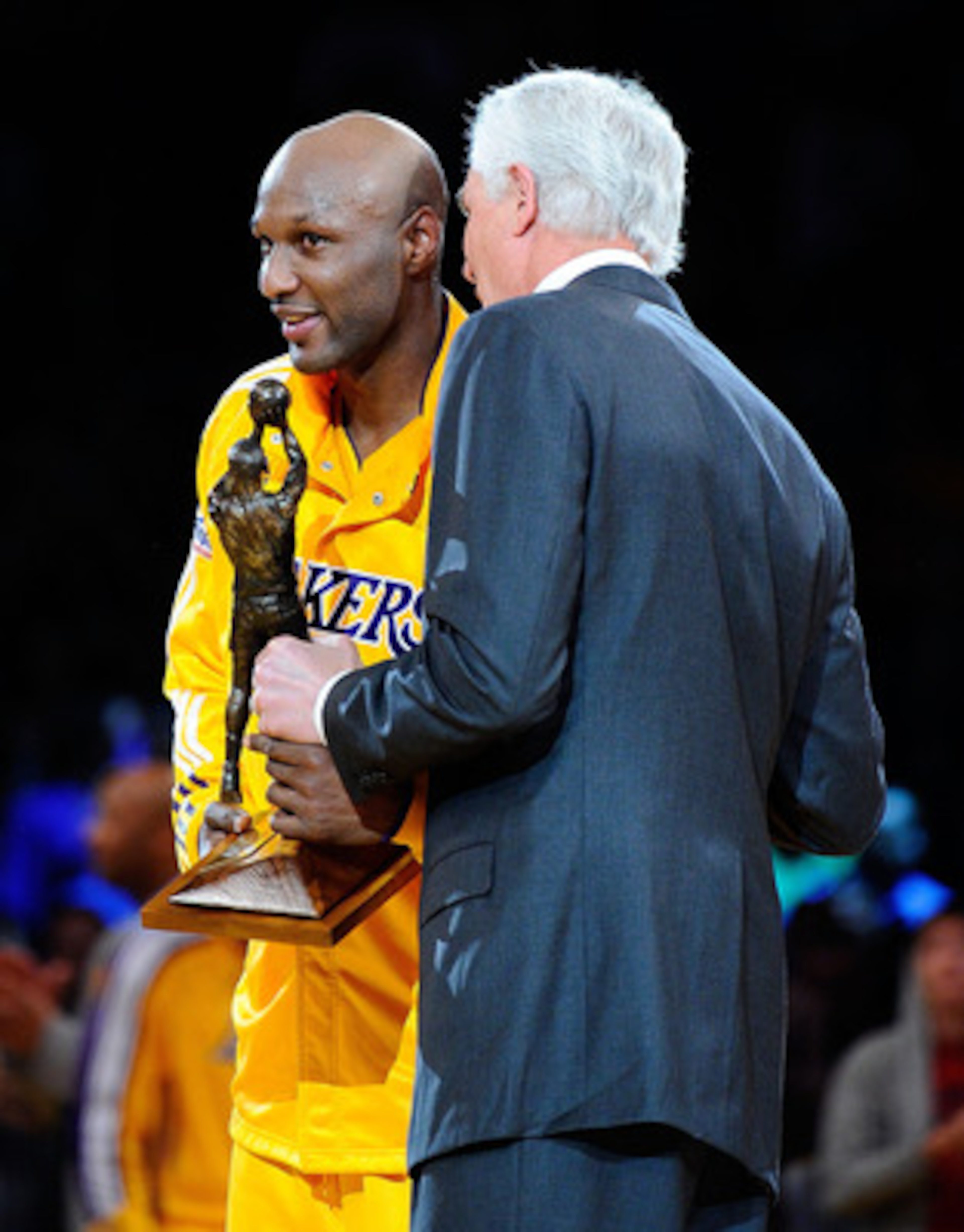 LOS ANGELES, CA - APRIL 20:  Lamar Odom #7 of the Los Angeles Lakers receives the Kia Six Man of the Year Award from Lakers General Manager Mitch Kupchak before Game Two of the Western Conference Quarterfinals in the 2011 NBA Playoffs against the New Orle