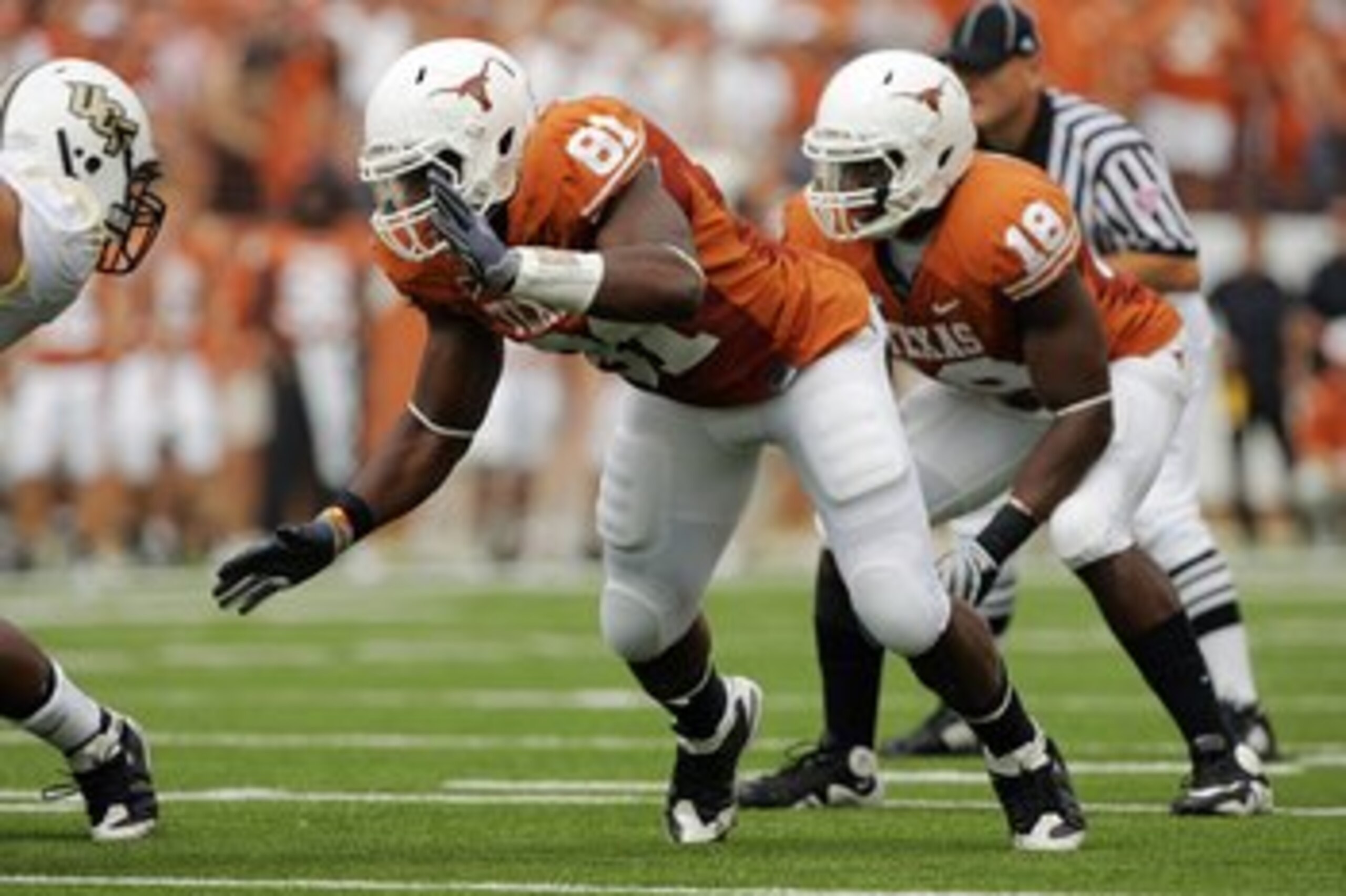 AUSTIN, TX - NOVEMBER 07:  Defensive end Sam Acho #81 and linebacker Emmanuel Acho #18 of the Texas Longhorns defend against the UCF Knights on November 7, 2009 at Darrell K Royal - Texas Memorial Stadium in Austin, Texas.  Texas won 35-3.  (Photo by Bria