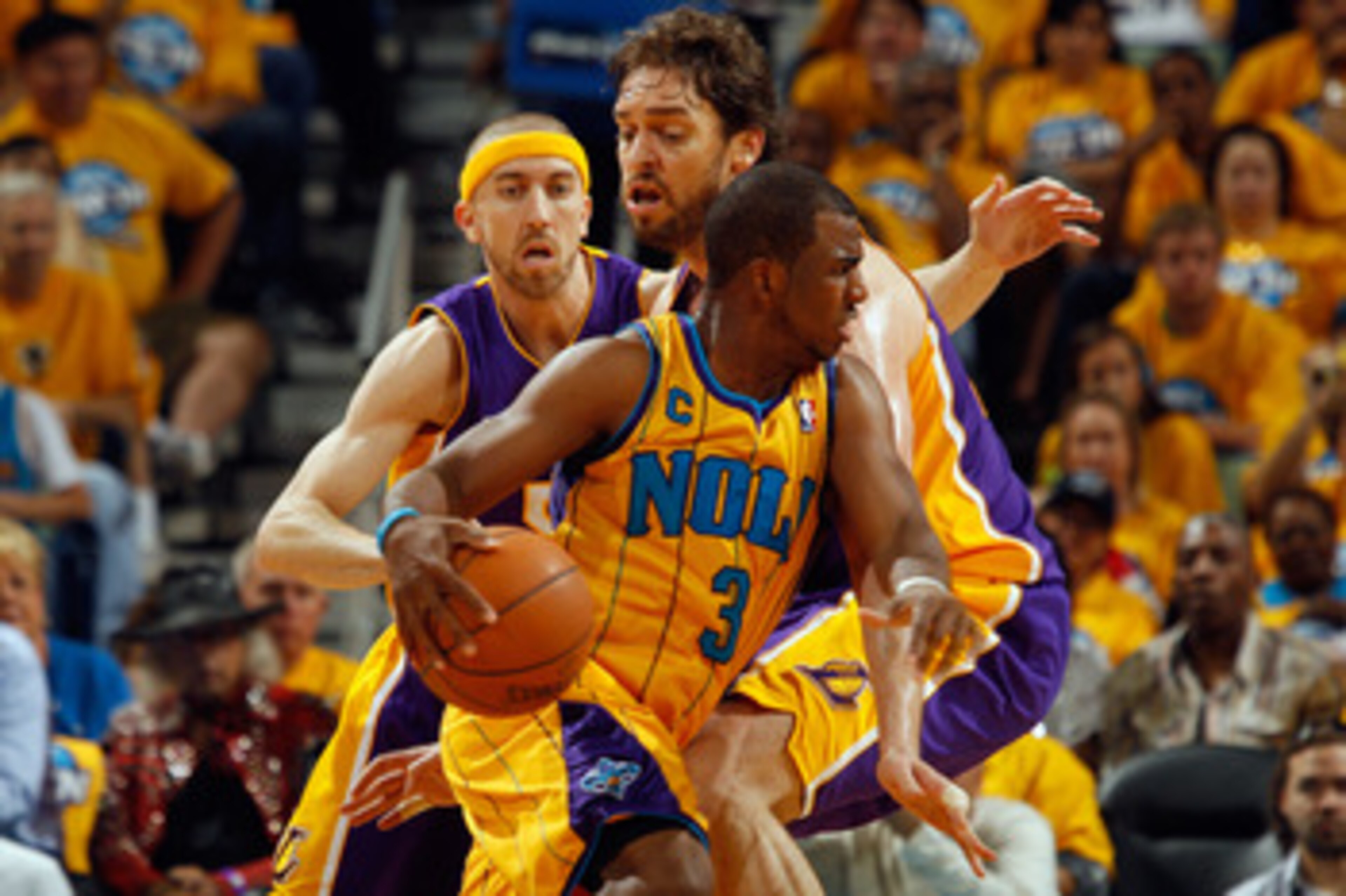 NEW ORLEANS, LA - APRIL 22:  Chris Paul #3 of the New Orleans Hornets drives the ball around Pau Gasol #16 of the Los Angeles Lakers in Game Three of the Western Conference Quarterfinals in the 2011 NBA Playoffs at the New Orleans Arena  on April 22, 2011