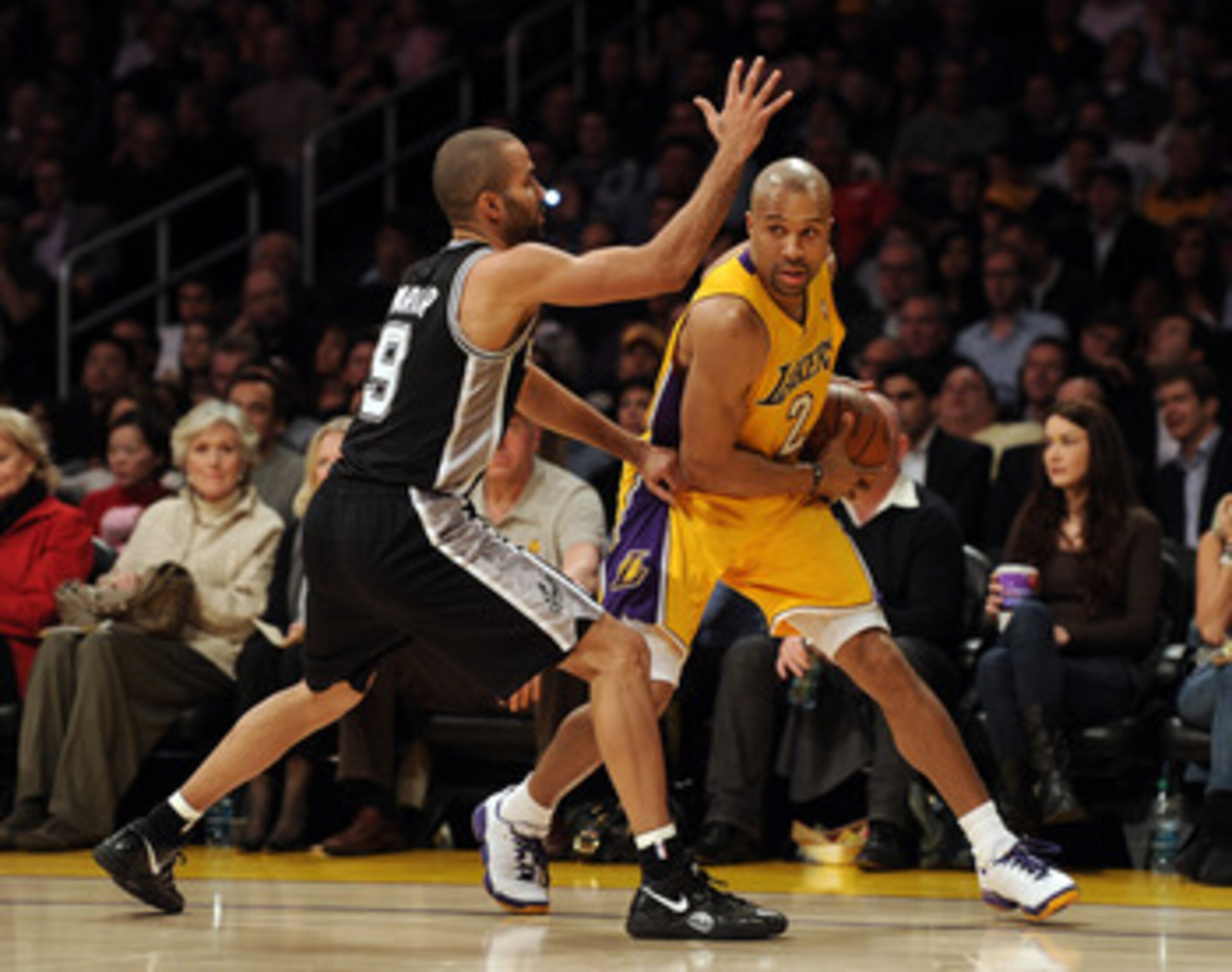 LOS ANGELES, CA - FEBRUARY 03:  Derek Fisher #2 of the Los Angeles Lakers is guarded by Tony Parker #9 of the San Antonio Spurs at Staples Center on February 3, 2011 in Los Angeles, California.  NOTE TO USER: User expressly acknowledges and agrees that, b