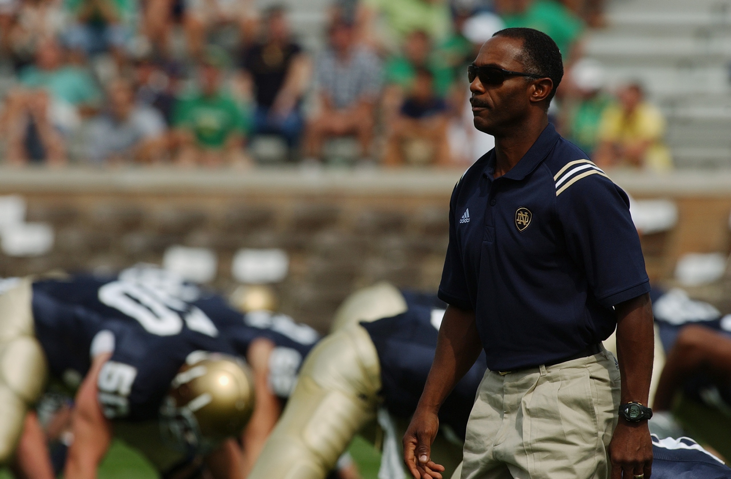 SOUTH BEND, IN - SEPTEMBER 11: Head coach Tyrone Willingham of the Notre Dame Fighting Irish watches warm up exercises before a game with the Michigan Wolverines on September 11, 2004 at Notre Dame Stadium in South Bend, Indiana. Notre Dame defeated Michi