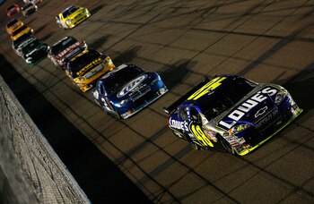 AVONDALE, AZ - NOVEMBER 09:  Jimmie Johnson, driver of the #48 Lowe's Chevrolet leads Kurt Busch, driver of the #2 Miller Lite Dodge, Jamie McMurray, driver of the IRWIN Industrial Tools Ford and Carl Edwards, driver of the #99 Office Depot Ford during th