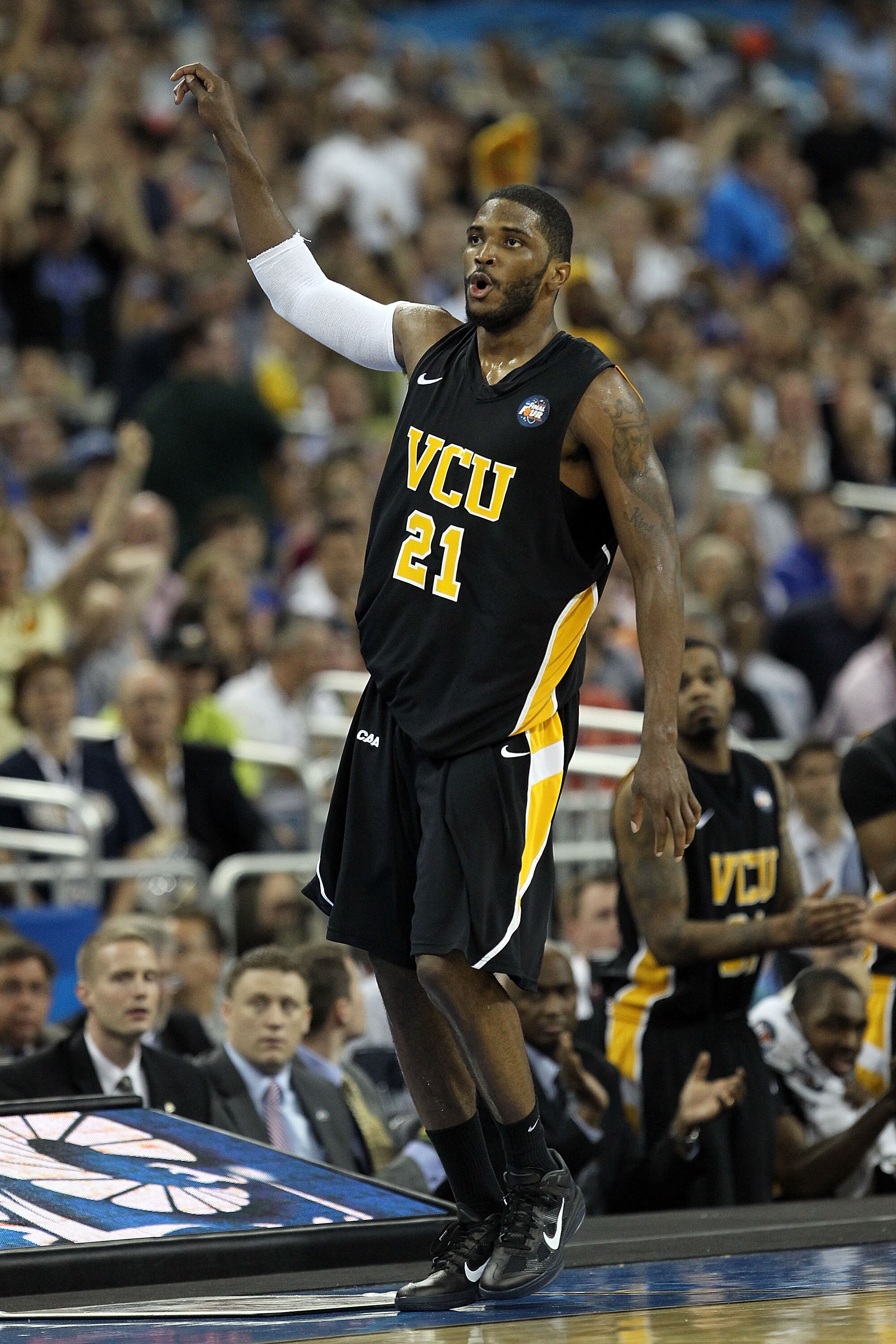 HOUSTON, TX - APRIL 02:  Jamie Skeen #21 of the Virginia Commonwealth Rams reacts after hitting a three pointer and drawing a foul against the Butler Bulldogs during the National Semifinal game of the 2011 NCAA Division I Men's Basketball Championship at