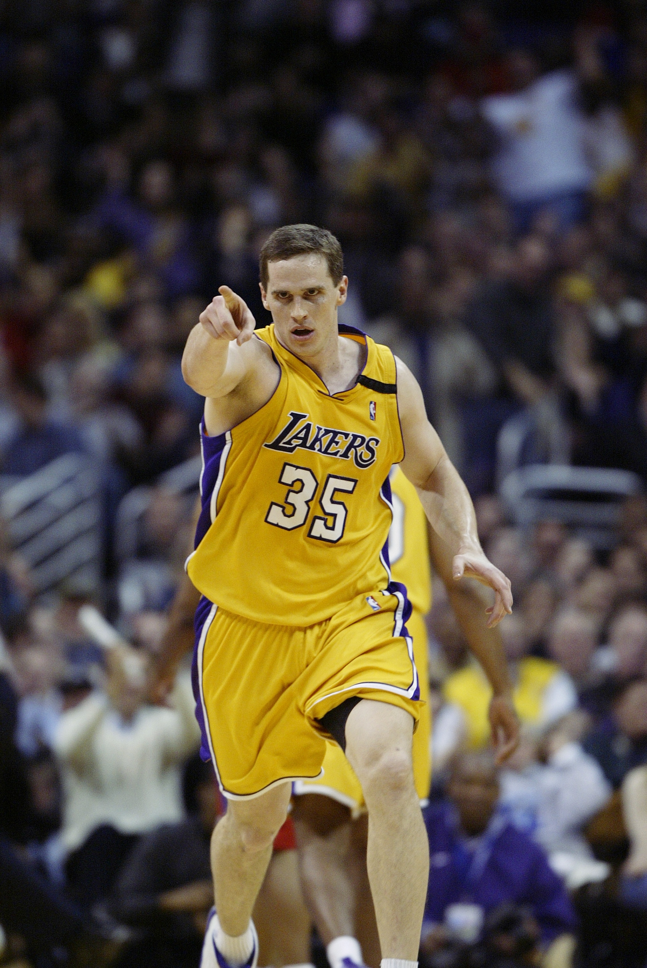 LOS ANGELES - FEBRUARY 25:  Mark Madsen #35 of the Los Angeles Lakers celbrates during the NBA game against the Los Angeles Clippers at Staples Center on February 25, 2003 in Los Angeles, California.  The Lakers won 109-98.  NOTE TO USER: User expressly a