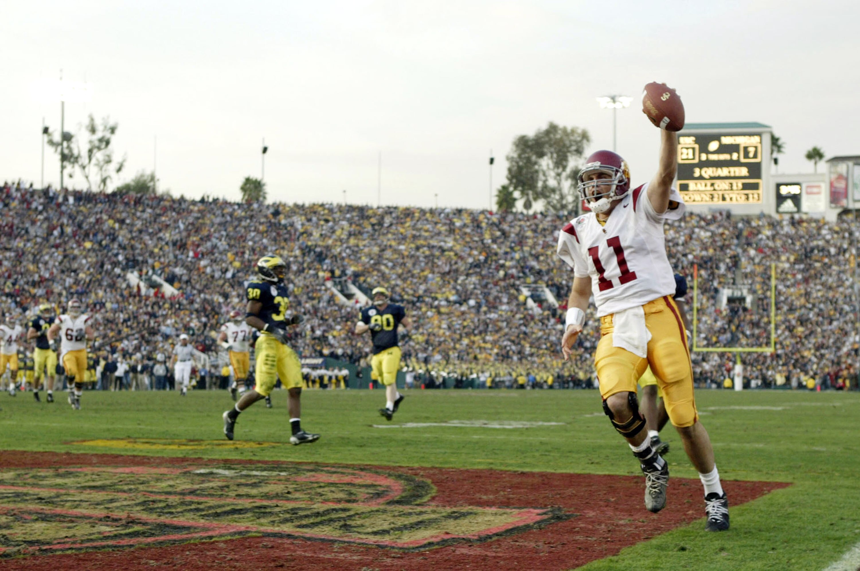 PASADENA, CA - JANUARY 1:  Quarterback Matt Leinart #11 of the USC Trojans celebrates his touchdown catch against the Michigan Wolverines in the 2004 Rose Bowl on January 1, 2004 at the Rose Bowl in Pasadena, California. Leinart was named the MVP as USC d