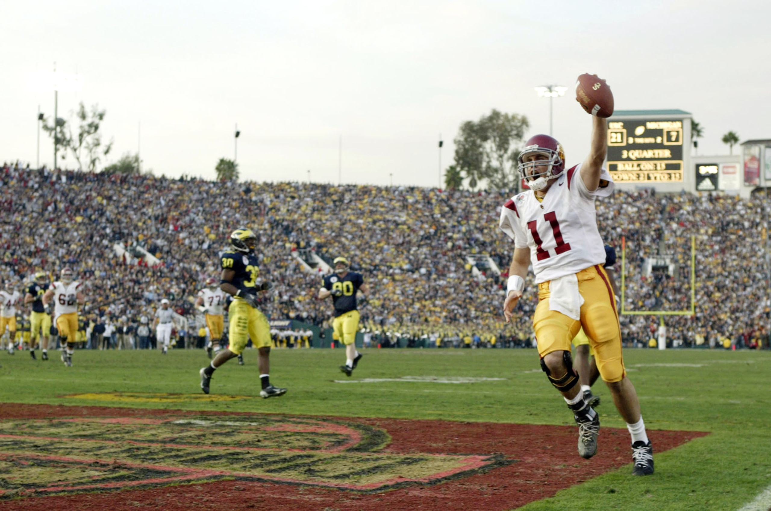 PASADENA, CA - JANUARY 1:  Quarterback Matt Leinart #11 of the USC Trojans celebrates his touchdown catch against the Michigan Wolverines in the 2004 Rose Bowl on January 1, 2004 at the Rose Bowl in Pasadena, California. Leinart was named the MVP as USC d