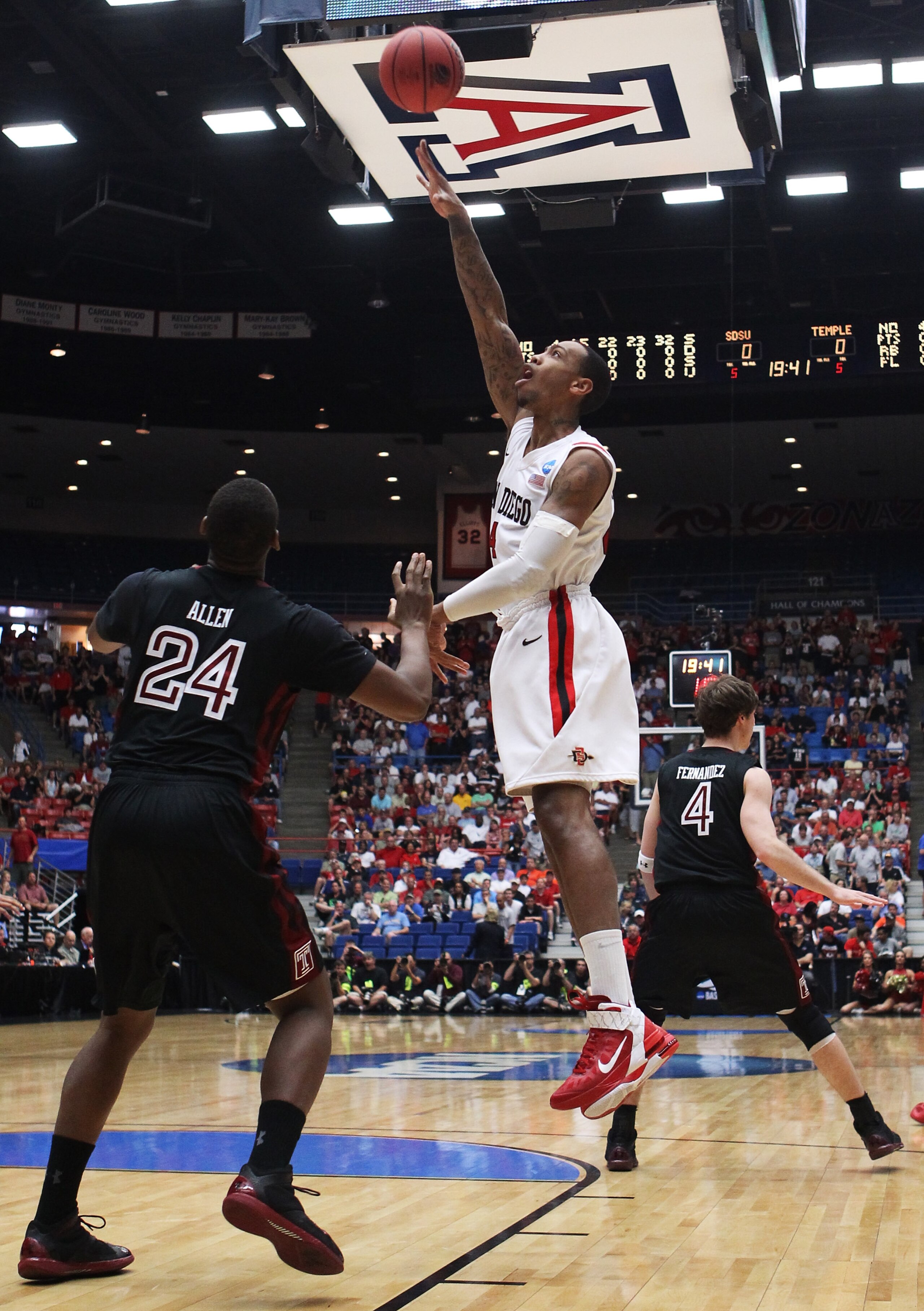 TUCSON, AZ - MARCH 19:  Malcolm Thomas #4 of the San Diego State Aztecs shoots over Lavoy Allen #24 of the Temple Owls during the third round of the 2011 NCAA men's basketball tournament at McKale Center on March 19, 2011 in Tucson, Arizona.  (Photo by Ch