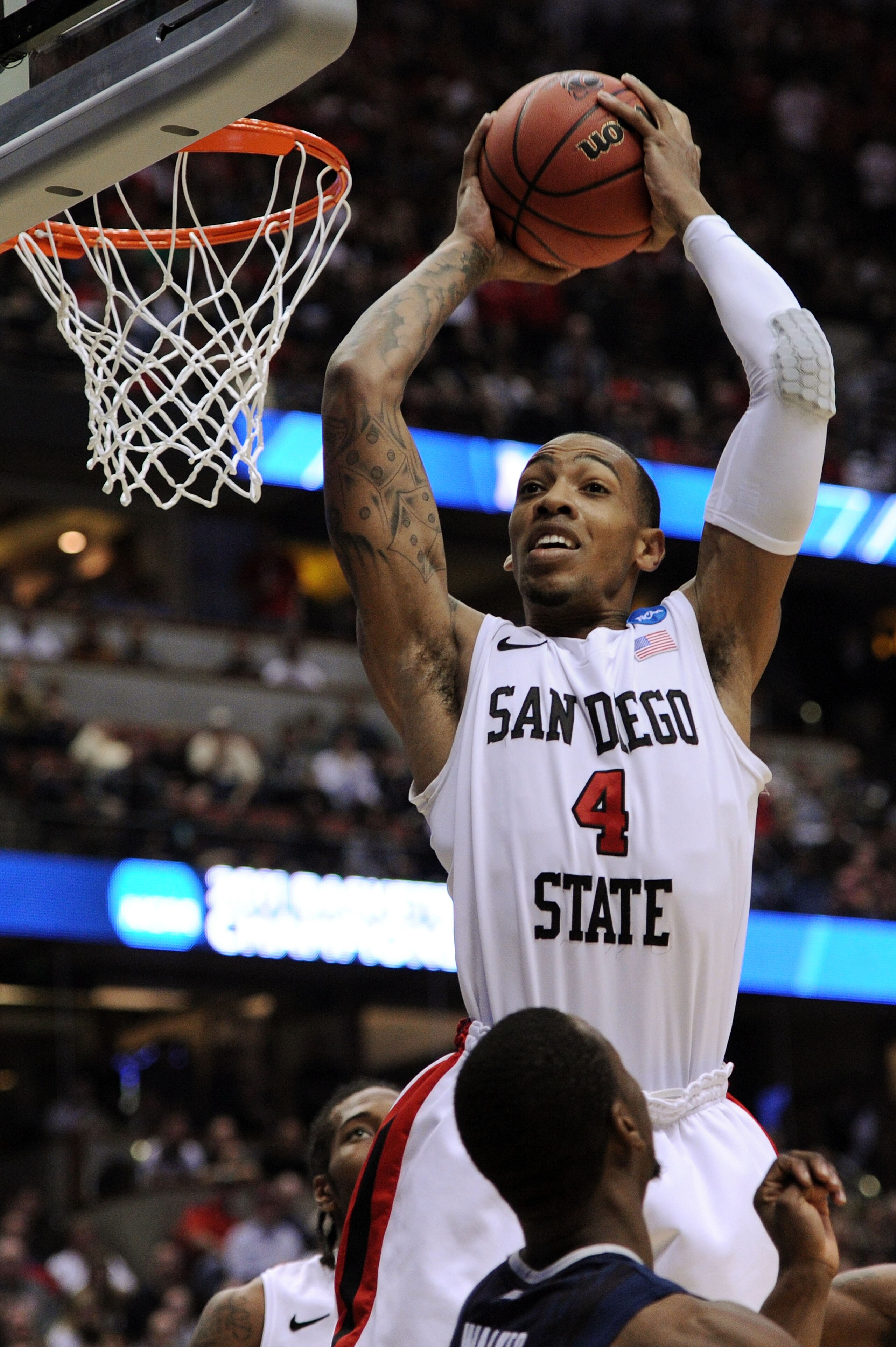 ANAHEIM, CA - MARCH 24: Malcolm Thomas #4 of the San Diego State Aztecs goes up for the ball against the Connecticut Huskies during the west regional semifinal of the 2011 NCAA men's basketball tournament at the Honda Center on March 24, 2011 in Anaheim, ANAHEIM, CA - MARCH 24: Malcolm Thomas #4 of the San Diego State Aztecs goes up for the ball against the Connecticut Huskies during the west regional semifinal of the 2011 NCAA men's basketball tournament at the Honda Center on March 24, 2011 in Anaheim,