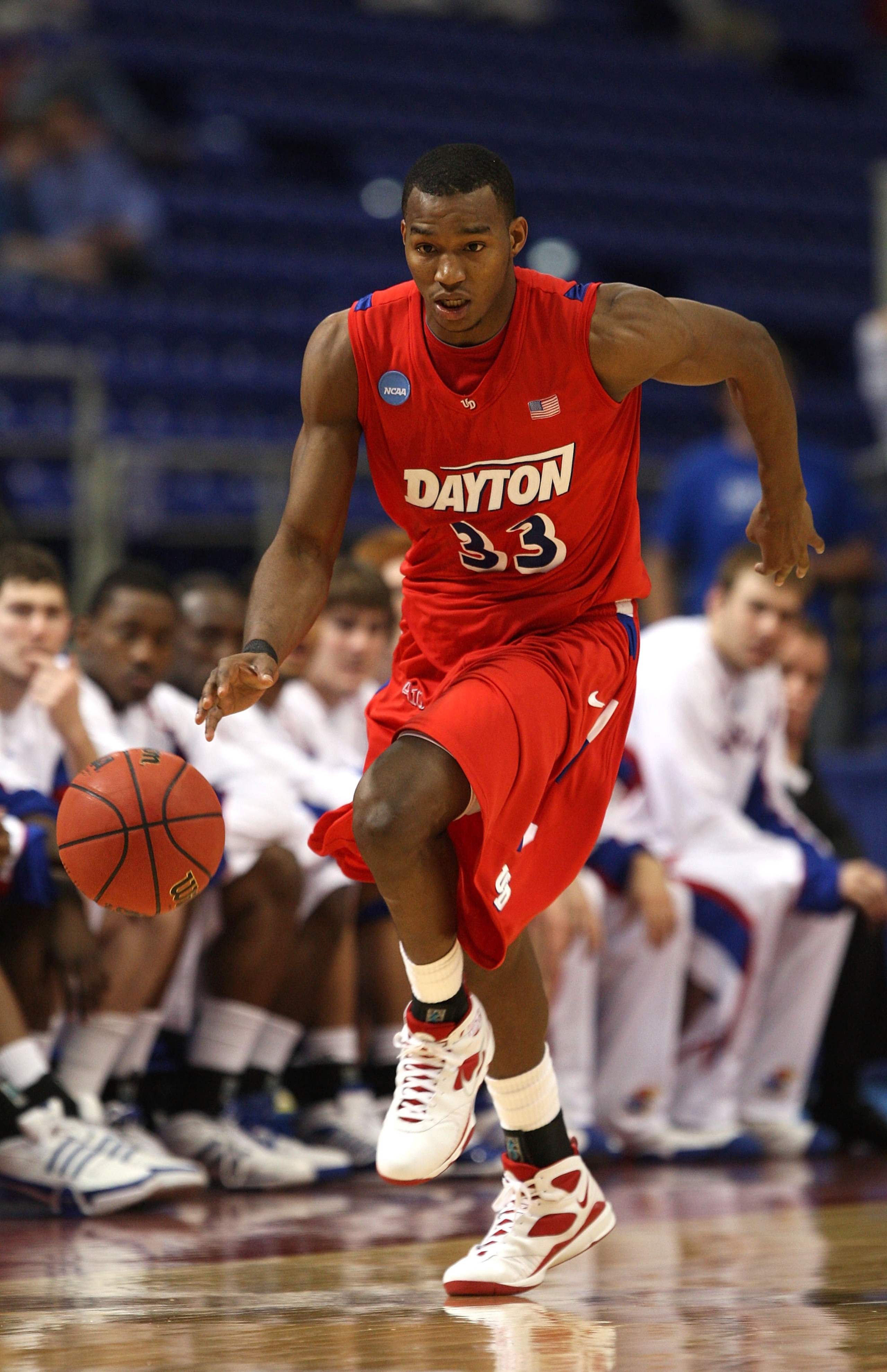 MINNEAPOLIS - MARCH 22: Chris Wright #33 of the Dayton Flyers brings the ball up court the Kansas Jayhawks during the second round of the NCAA Division I Men's Basketball Tournament at the Hubert H. Humphrey Metrodome on March 22, 2009 in Minneapolis, Mi MINNEAPOLIS - MARCH 22: Chris Wright #33 of the Dayton Flyers brings the ball up court the Kansas Jayhawks during the second round of the NCAA Division I Men's Basketball Tournament at the Hubert H. Humphrey Metrodome on March 22, 2009 in Minneapolis, Mi