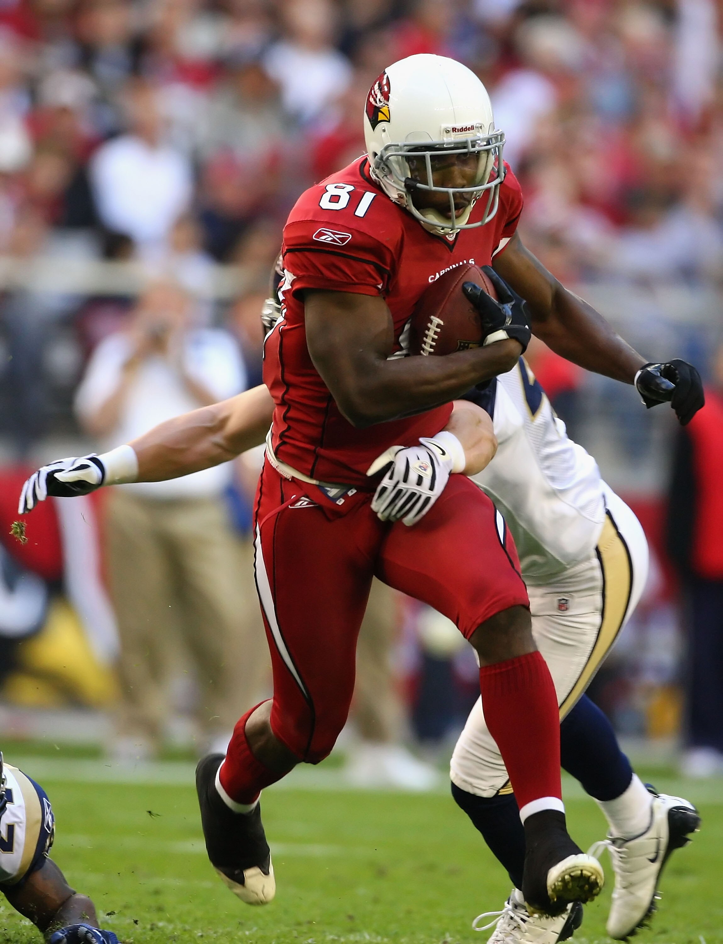 GLENDALE, AZ - DECEMBER 27:  Wide receiver Anquan Boldin #81 of the Arizona Cardinals rushes the football against the St. Louis Rams during the NFL game at the Universtity of Phoenix Stadium on December 27, 2009 in Glendale, Arizona. The Cardinals defeate