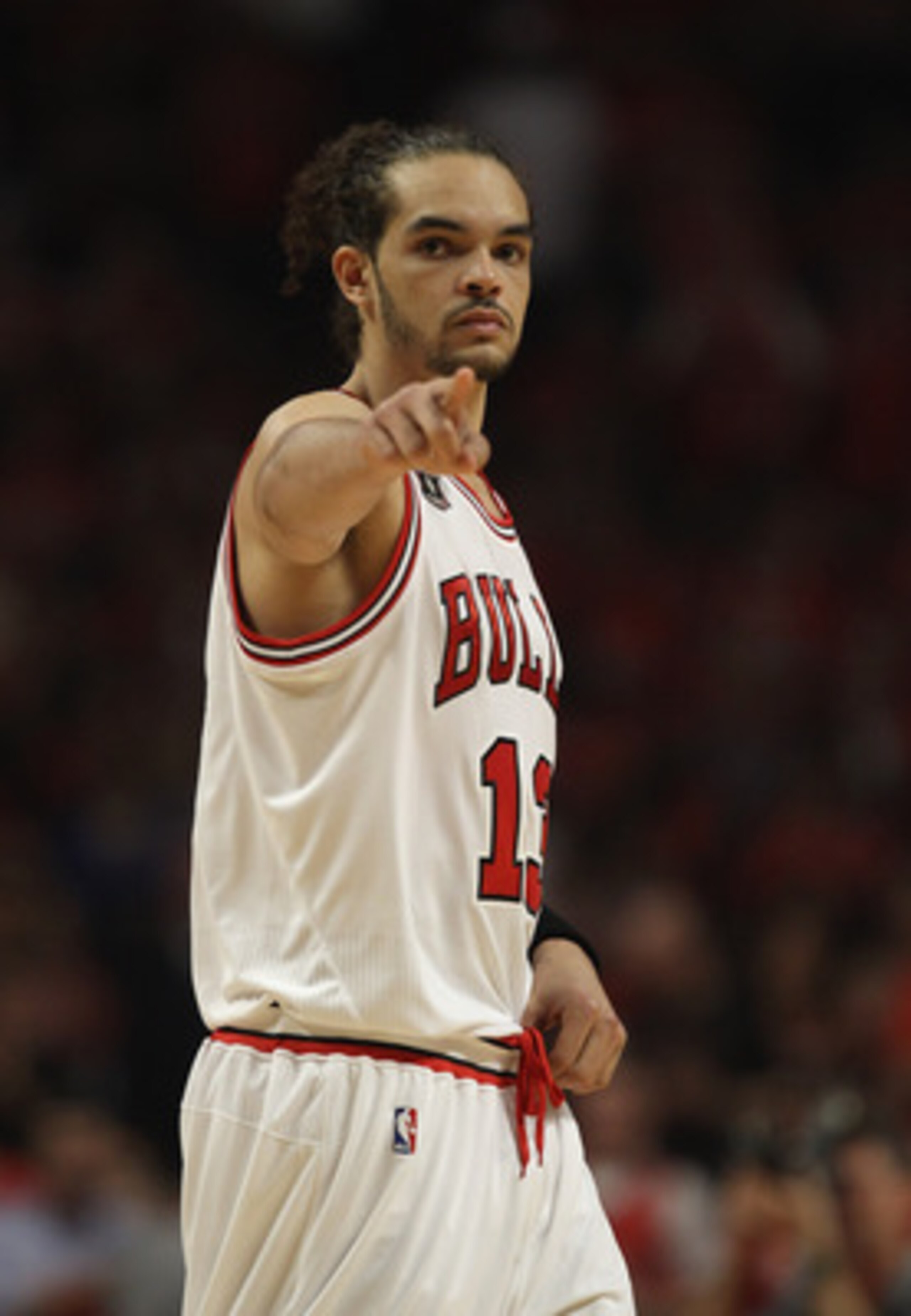 CHICAGO, IL - MAY 10: Joakim Noah #13 of the Chicago Bulls points to family in the stands before taking on Atlanta Hawks in Game Five of the Eastern Conference Semifinals in the 2011 NBA Playoffs at the United Center on May 10, 2011 in Chicago, Illinois. 