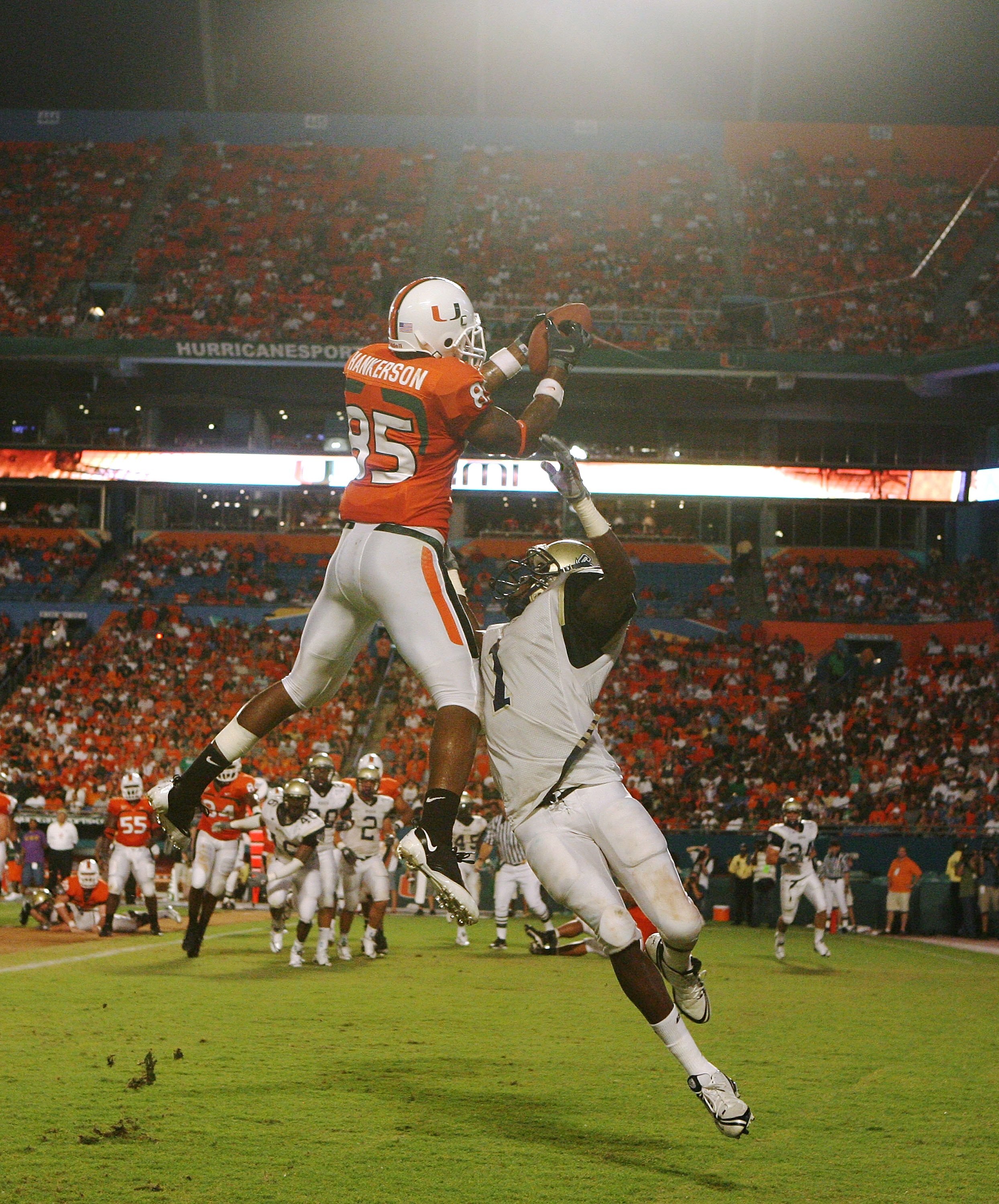 MIAMI - AUGUST 28:  Defensive back Phillip Ashley #1 of the Charleston Southern Buccaneers tries ot knock down a pass intended for wide receiver Leonard Hankerson #85 of the Miami Hurricanes at Dolphin Stadium on August 28, 2008 in Miami, Florida. Miami d