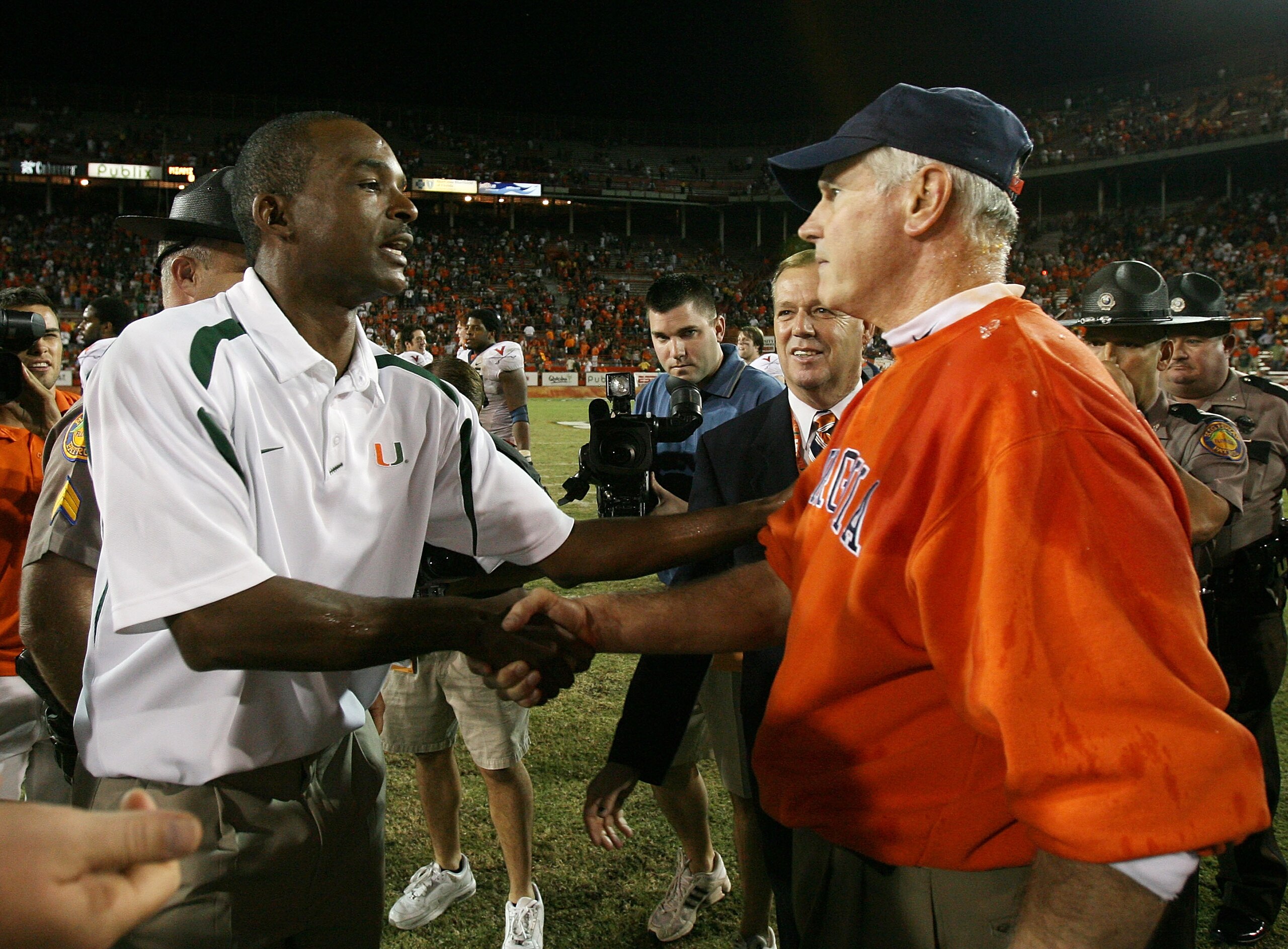 CORAL GABLES, FL - NOVEMBER 10:  Head coach Al Groh of the Virginia Cavaliers is congratulated by Randy Shannon of the Miami Hurricanes at the Orange Bowl November 10, 2007 in Coral Gables, Florida. The Hurricanes played their last game in the Orange Bowl