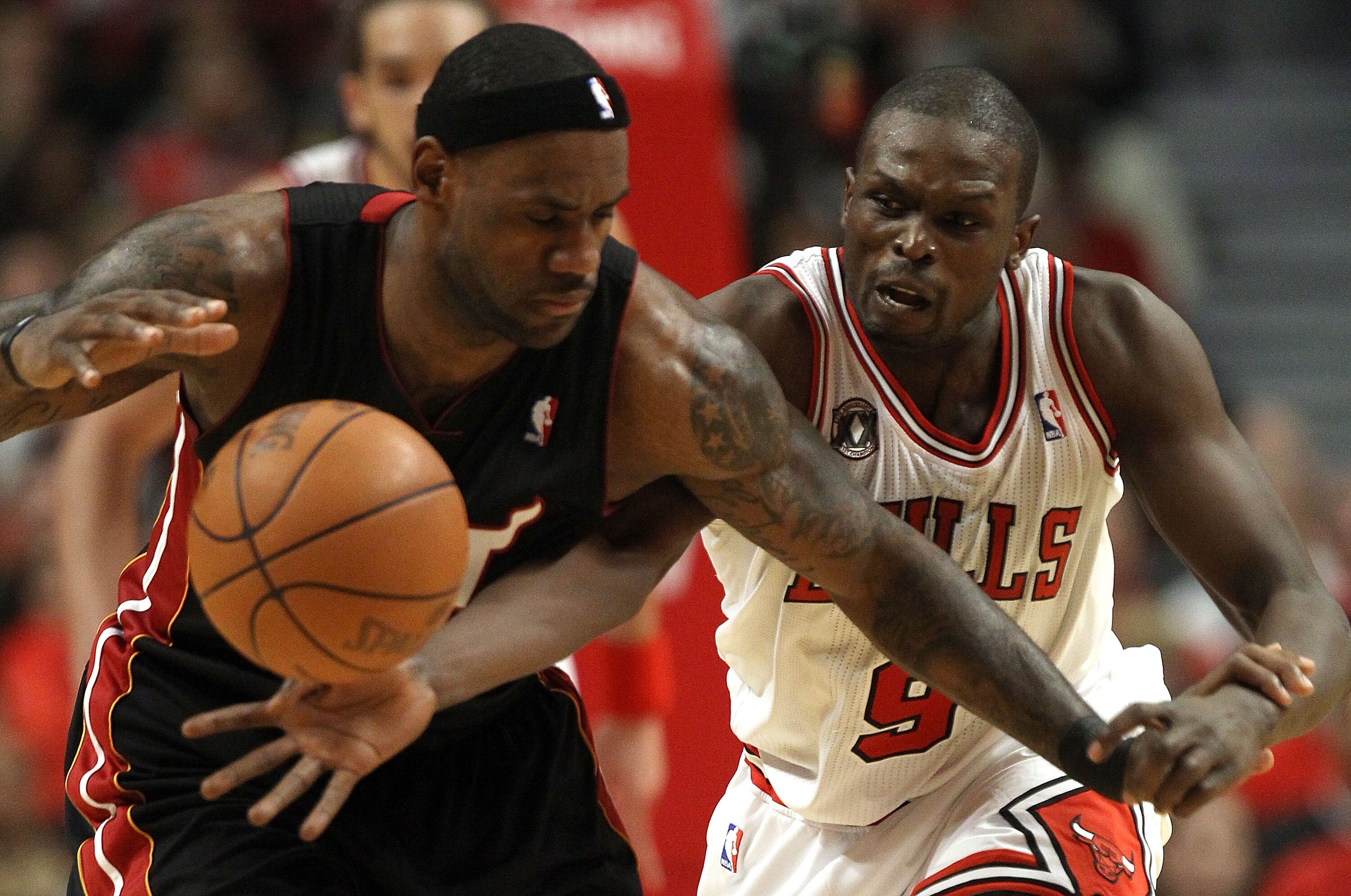 CHICAGO, IL - MAY 15:  Luol Deng #9 of the Chicago Bulls attempts to steal the ball from LeBron James #6 of the Miami Heat in Game One of the Eastern Conference Finals during the 2011 NBA Playoffs on May 15, 2011 at the United Center in Chicago, Illinois.