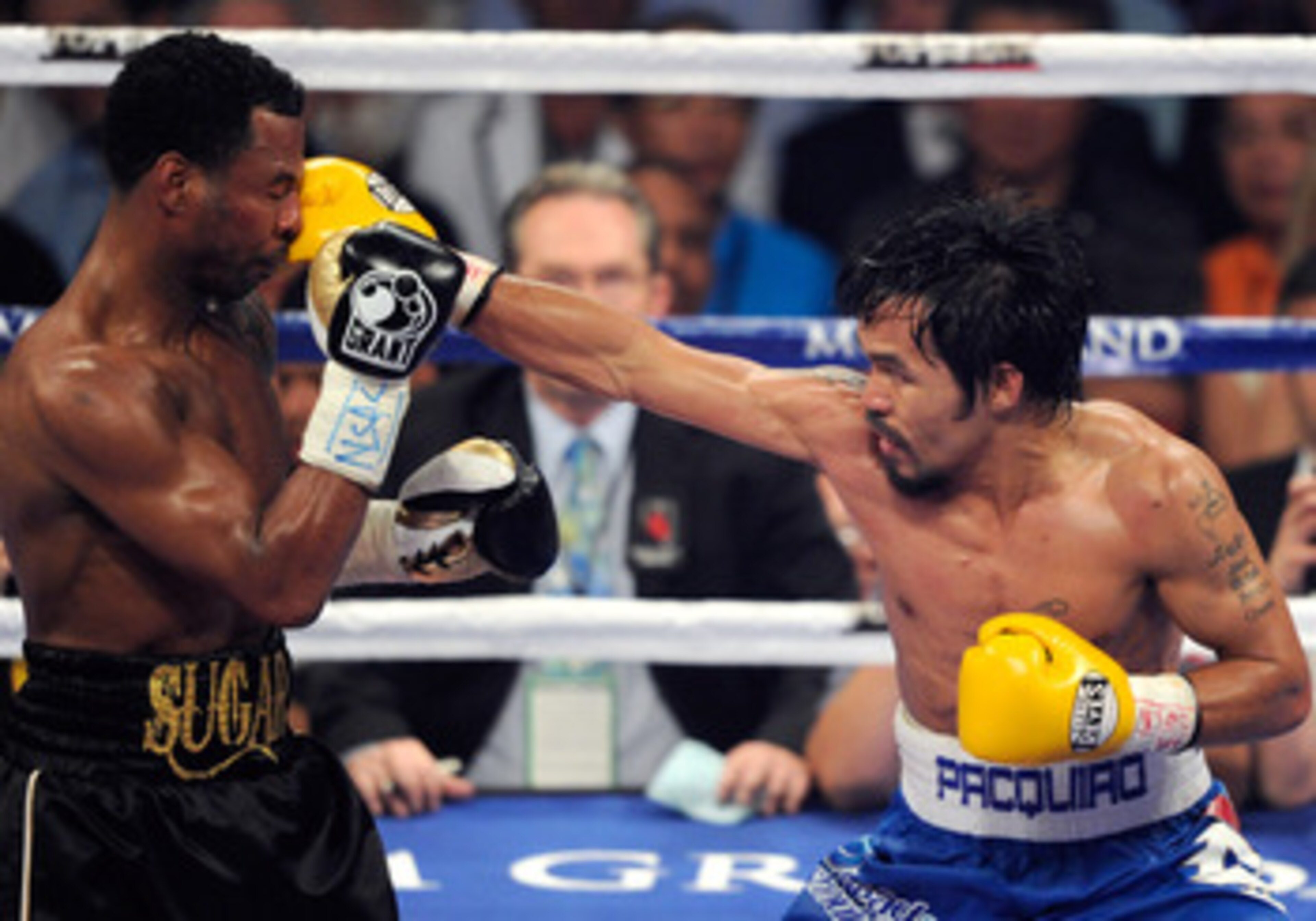 LAS VEGAS, NV - MAY 07:  Manny Pacquiao (R) hits Shane Mosley in the seventh round of their WBO welterweight title fight at the MGM Grand Garden Arena May 7, 2011 in Las Vegas, Nevada. Pacquiao retained his title with a unanimous-decision victory.  (Photo