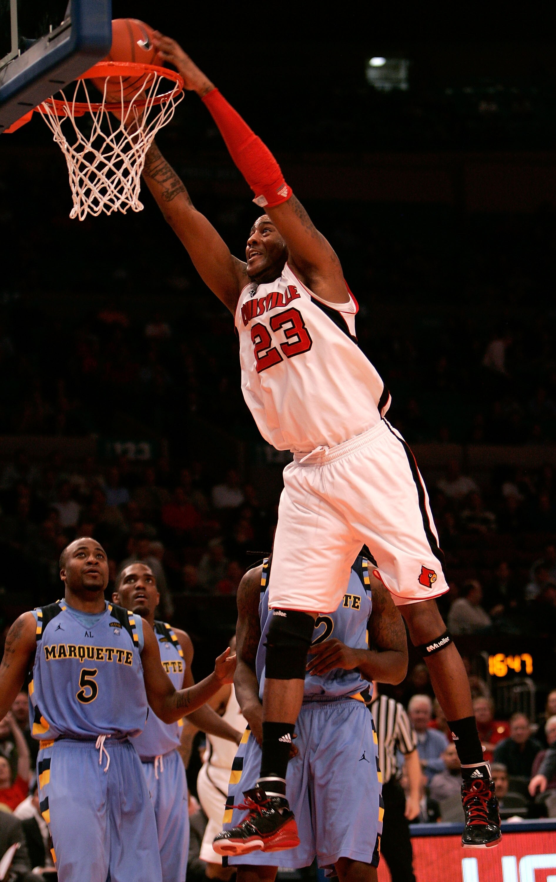 NEW YORK, NY - MARCH 10: Terrence Jennings #23 of the Louisville Cardinals dunks the ball against the Marquette Golden Eagles during the quarterfinals of the 2011 Big East Men's Basketball Tournament presented by American Eagle Outfitters  at Madison Squa