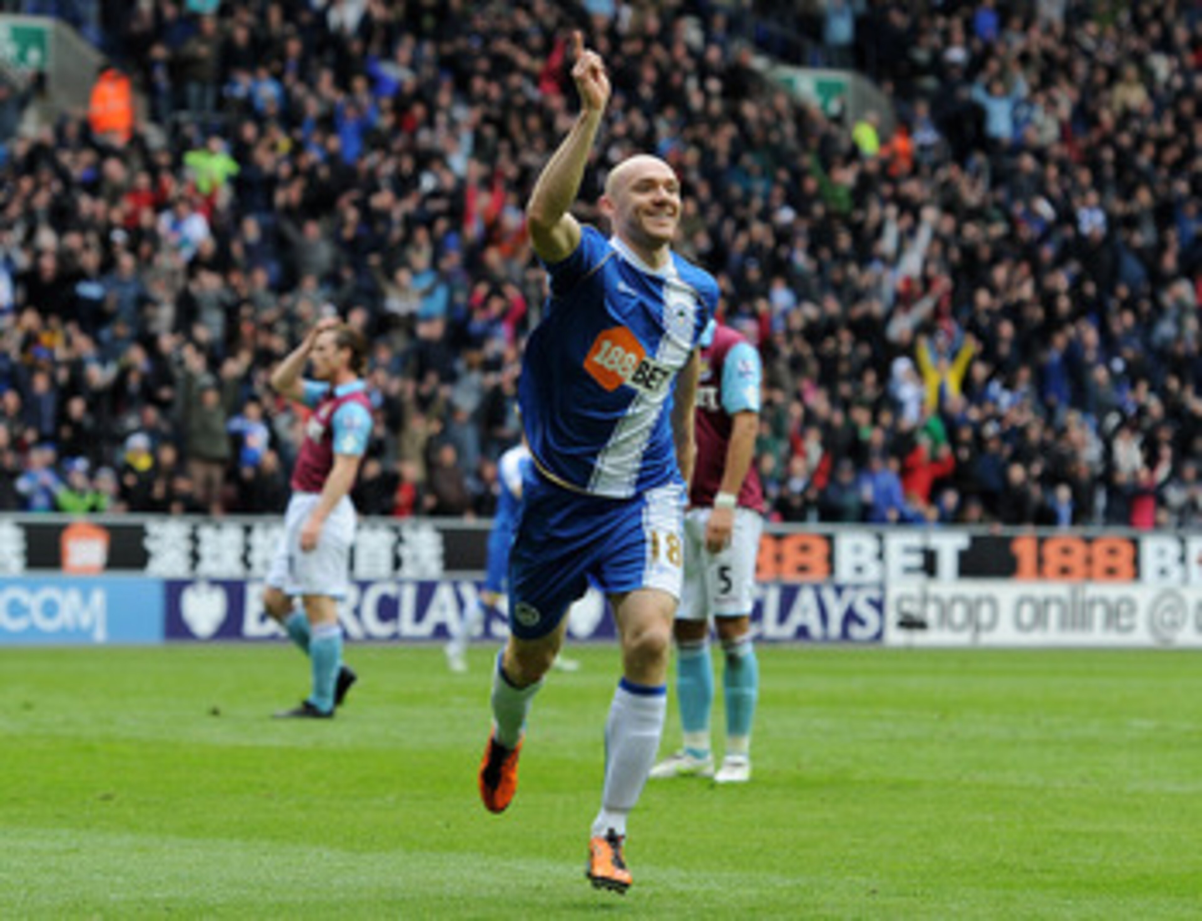 WIGAN, ENGLAND - MAY 15:  Conor Sammon of Wigan Athletic celebrates scoring his team's second goal during the Barclays Premier League match between Wigan Athletic and West Ham United at the DW Stadium on May 15, 2011 in Wigan, England.  (Photo by Chris Br