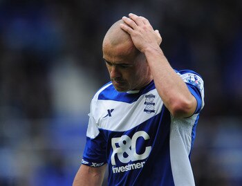 BIRMINGHAM, ENGLAND - MAY 15:  Birmingham City captain Stephen Carr is dejected at the final whistle at the end of the Barclays Premier League match between Birmingham City and Fulham at St. Andrews on May 15, 2011 in Birmingham, England.  (Photo by Shaun