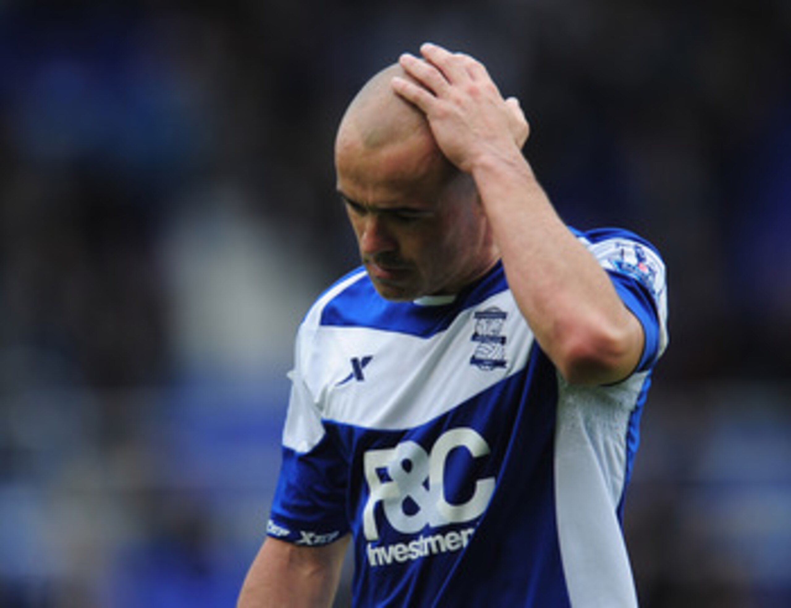 BIRMINGHAM, ENGLAND - MAY 15:  Birmingham City captain Stephen Carr is dejected at the final whistle at the end of the Barclays Premier League match between Birmingham City and Fulham at St. Andrews on May 15, 2011 in Birmingham, England.  (Photo by Shaun