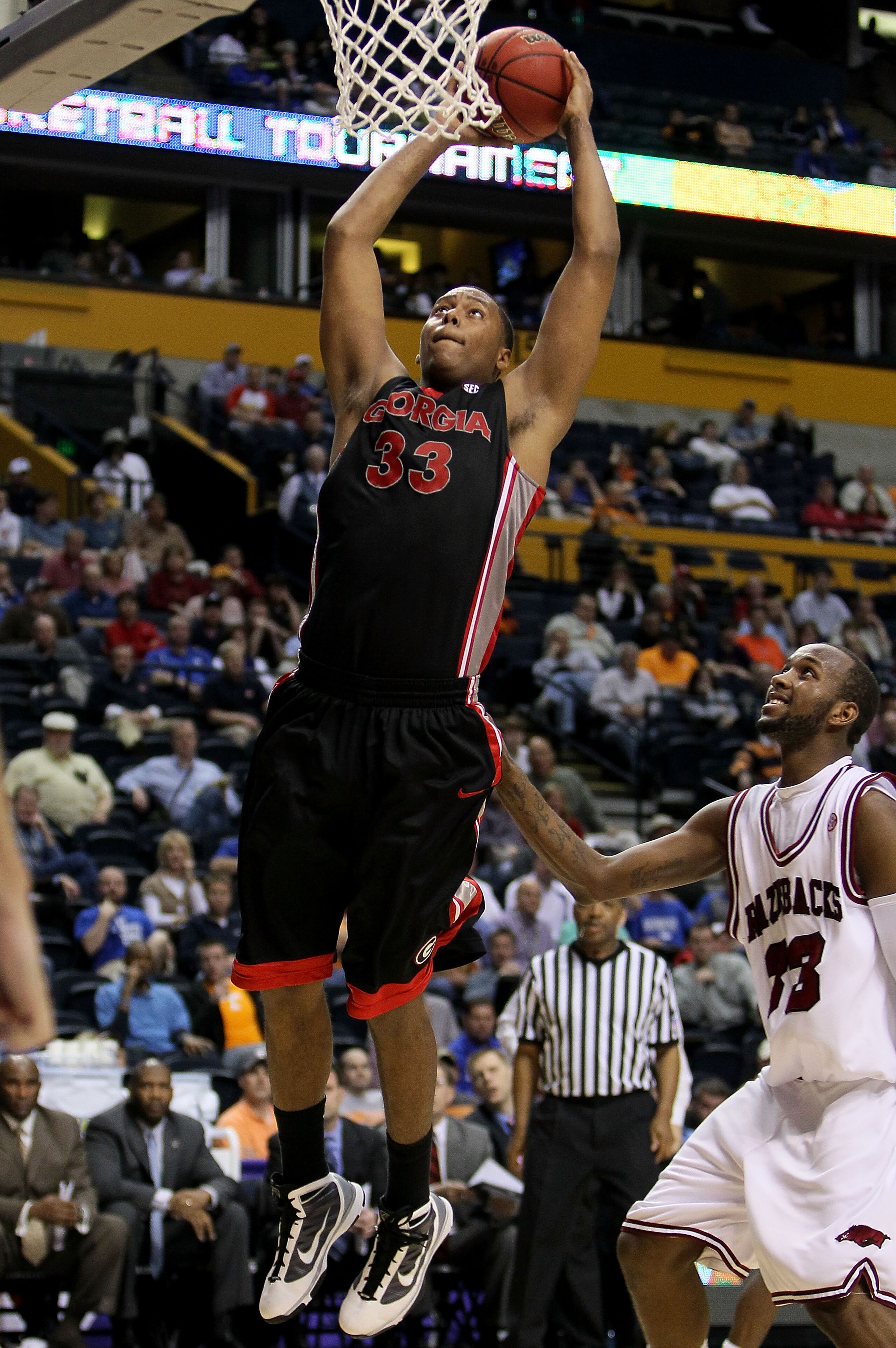 NASHVILLE, TN - MARCH 11: Trey Thompkins #33 of the Georgia Bulldogs goes up for a dunk attempt against the Arkanasas Razorbacks during the first round of the SEC Men's Basketball Tournament at the Bridgestone Arena on March 11, 2010 in Nashville, Tennes NASHVILLE, TN - MARCH 11: Trey Thompkins #33 of the Georgia Bulldogs goes up for a dunk attempt against the Arkanasas Razorbacks during the first round of the SEC Men's Basketball Tournament at the Bridgestone Arena on March 11, 2010 in Nashville, Tennes