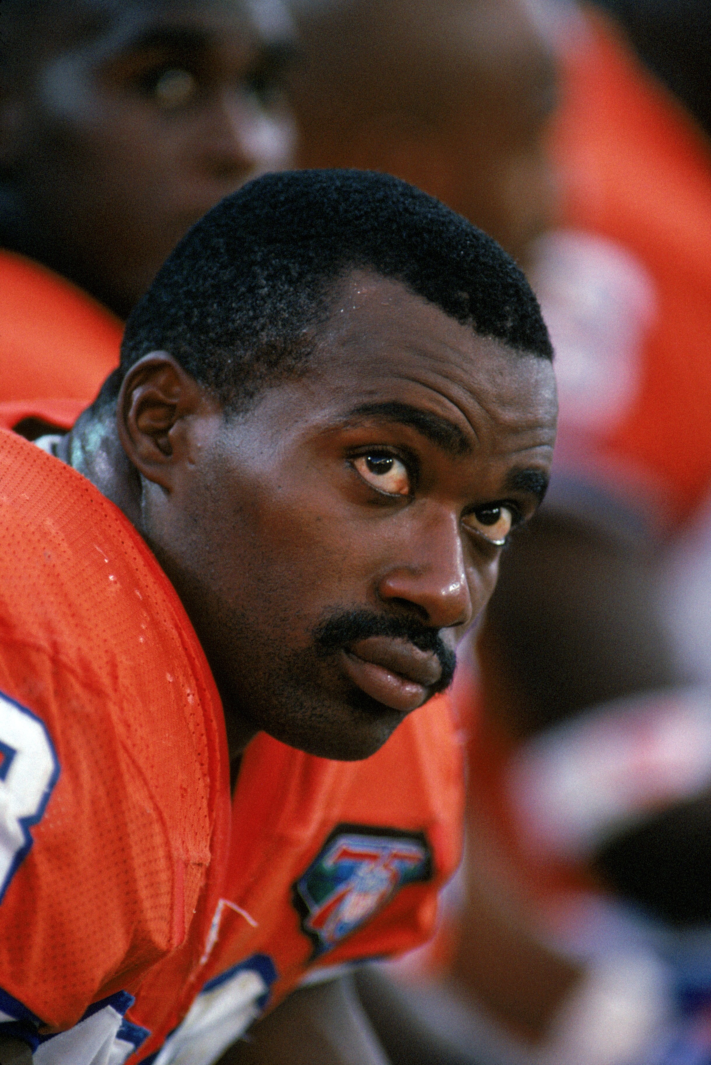 DENVER - SEPTEMBER 4:  Linebacker Simon Fletcher #73 of the Denver Broncos looks on as he sites on the sideline bench during a game against the San Diego Chargers at Mile High Stadium on September 4, 1994 in Denver, Colorado.  The Broncos won 37-34.  (Pho