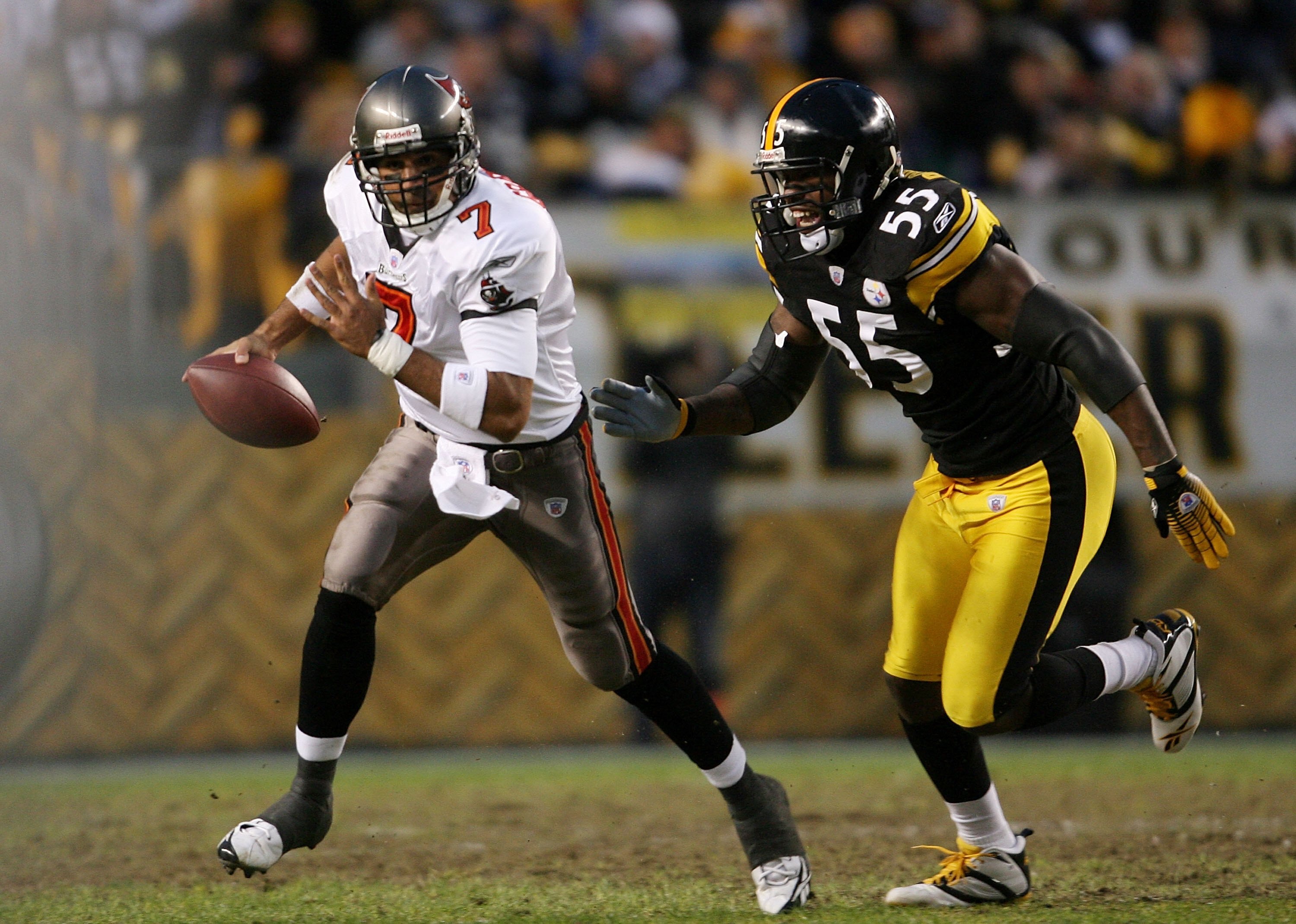 PITTSBURGH - DECEMBER 03:  Bruce Gradkowski #7 of the Tampa Bay Buccaneers rushes under chase from Joey Porter #55 of the Pittsburgh Steelers at Heinz Field on December 3, 2006 in Pittsburgh, Pennsylvania.  (Photo by Nick Laham/Getty Images)