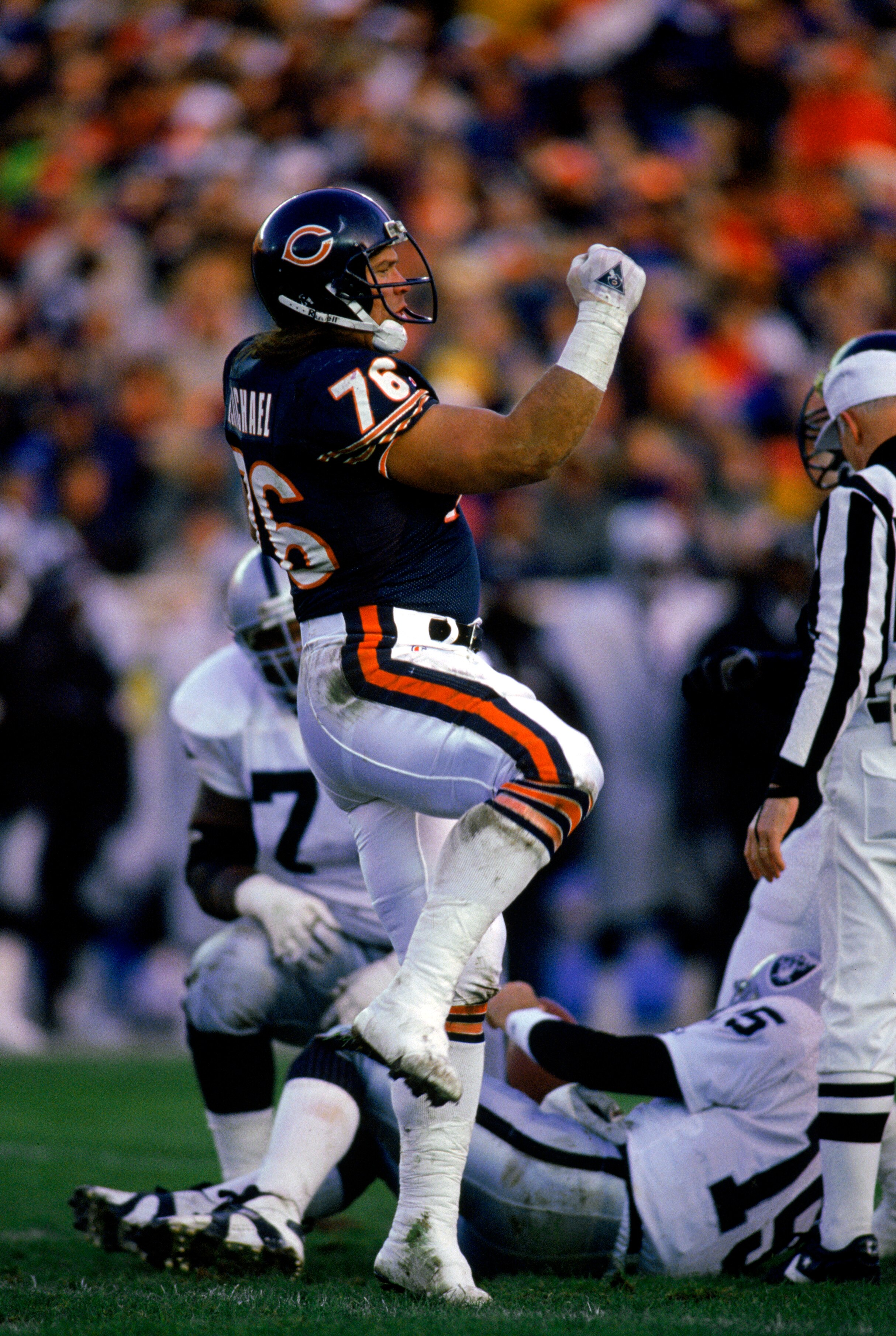 CHICAGO - NOVEMBER 7:  Steve McMichael #76 of the Chicago Bears celebrates during the game against the Los Angeles Raiders on November 7, 1993 in Chicago, Illinois. The Raiders won 16-14. (Photo by Jonathan Daniel/Getty Images)